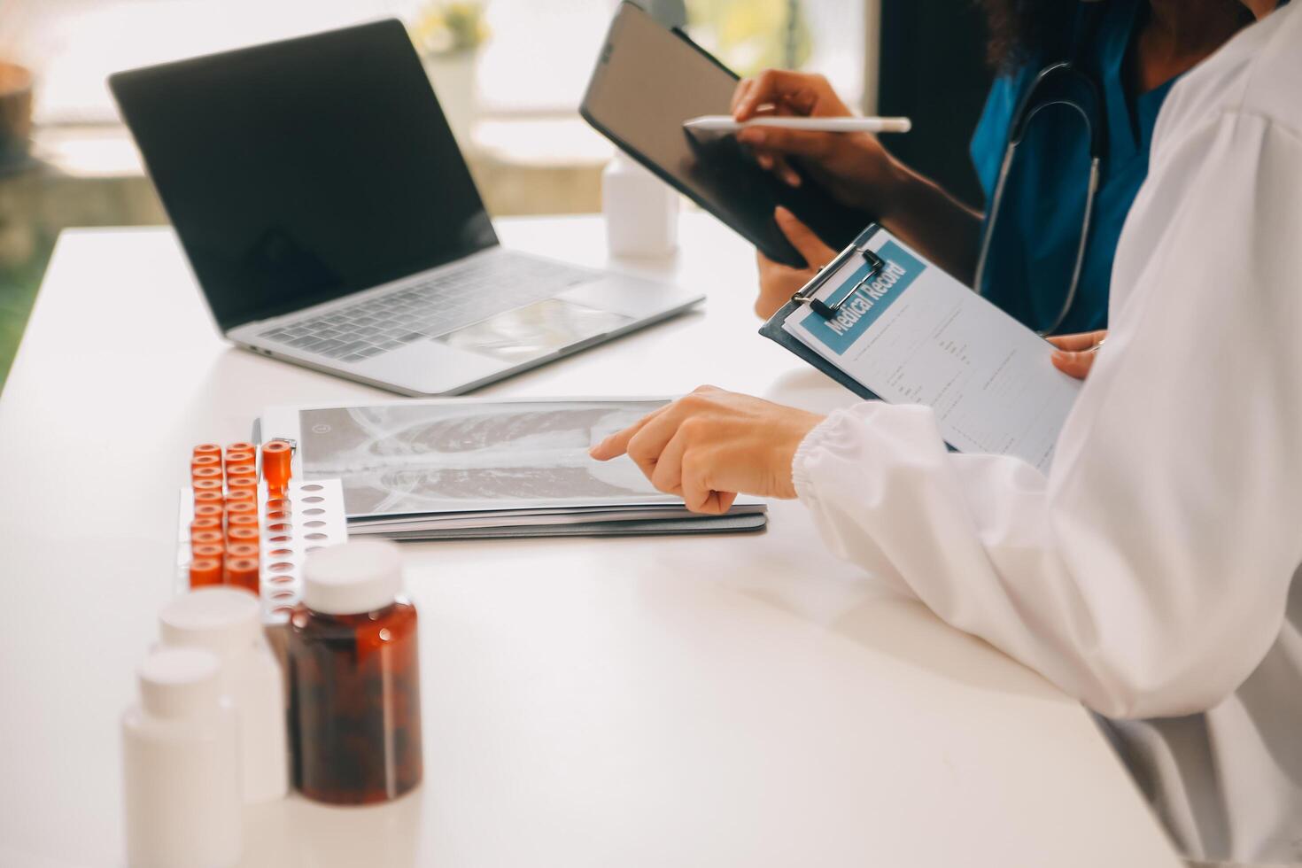biochemical research scientist team working with microscope for coronavirus vaccine development in pharmaceutical research labolatory, selective focus photo