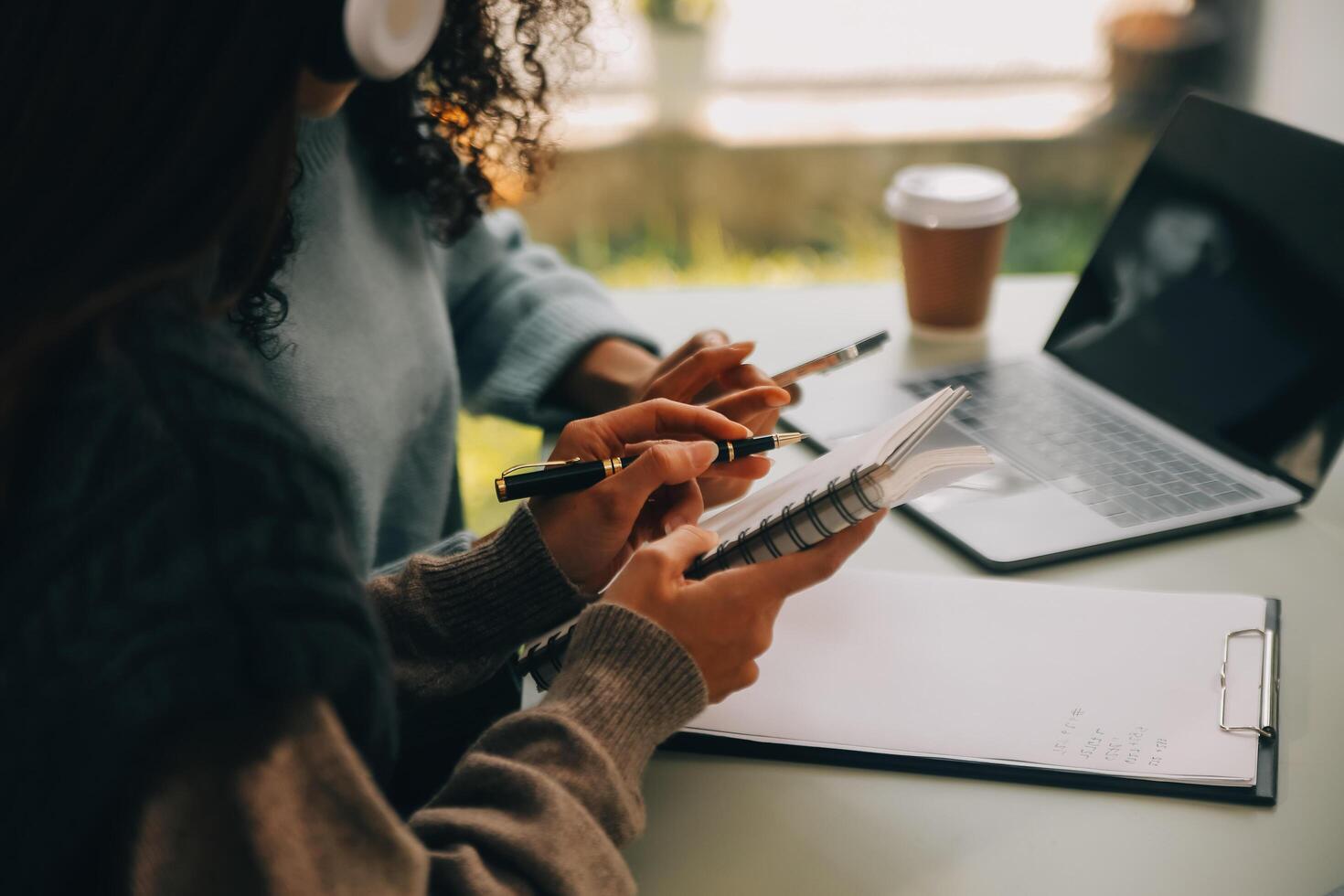 Asian businesswoman working on laptop computer Look for job online, freelance looking and typing on notebook on table, lifestyle of woman studying online photo