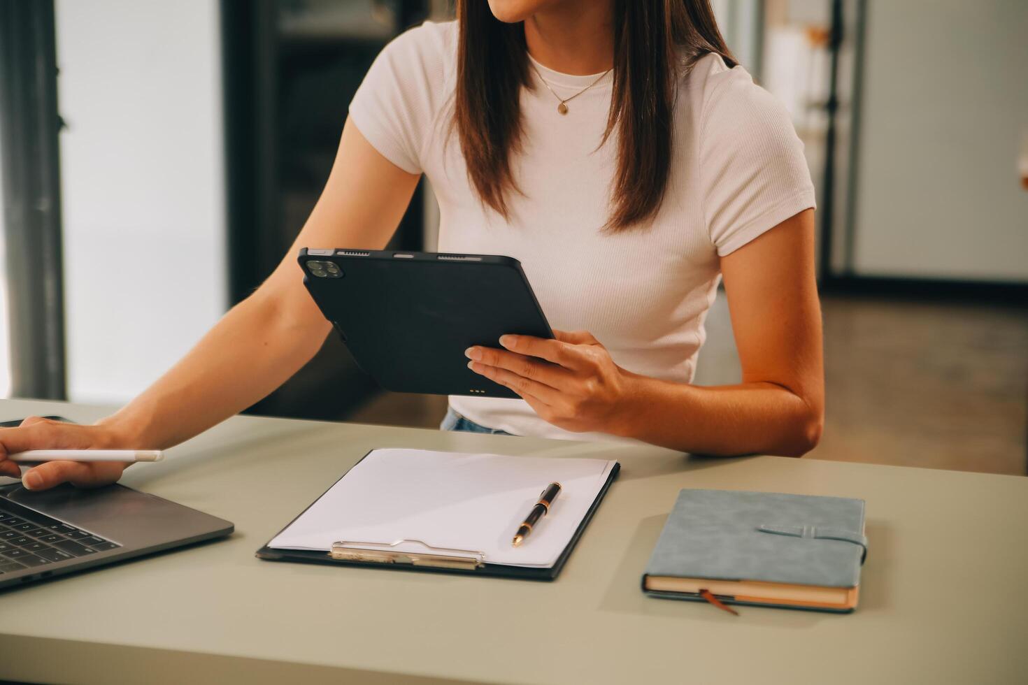 Asian businesswoman working on laptop computer Look for job online, freelance looking and typing on notebook on table, lifestyle of woman studying online photo