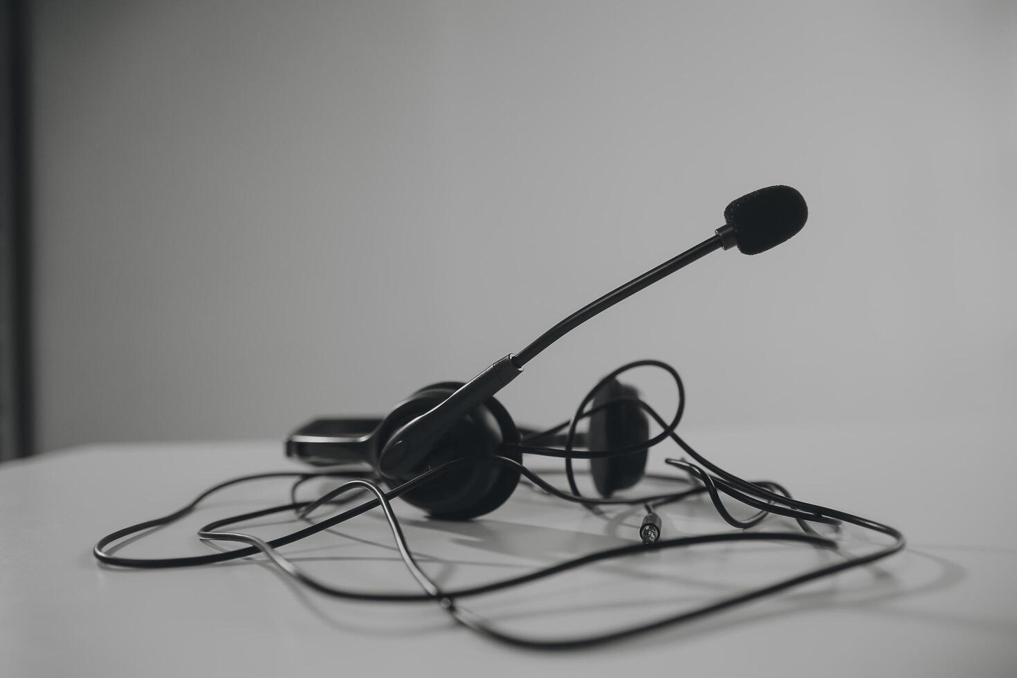 Communication support, call center and customer service help desk. VOIP headset on telephone keyboard. photo