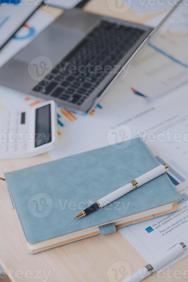 Finance manager meeting discussing company growth project success financial statistics, professional investor working start up project for strategy plan with document, laptop and digital tablet. photo