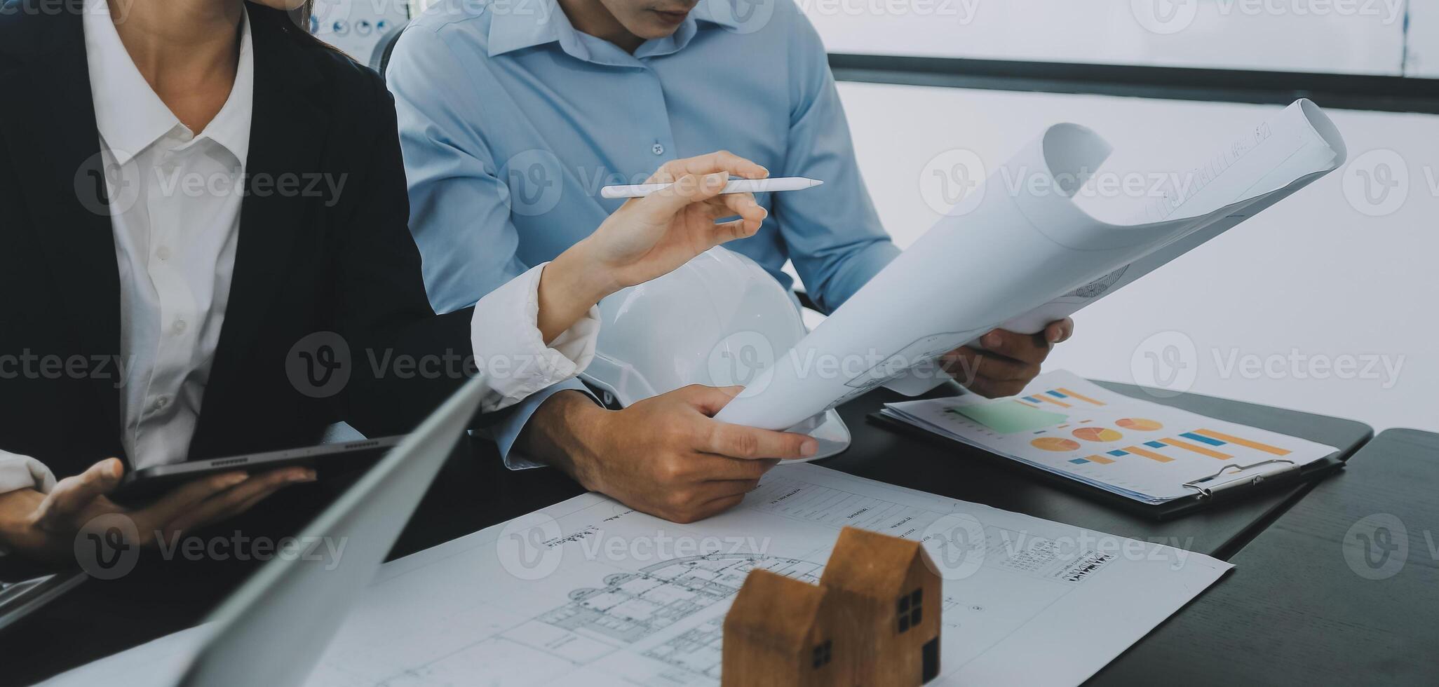 Engineer Teamwork Meeting, Drawing working on blueprint meeting for project working with partner on model building and engineering tools in working site, Construction and structure concept. photo