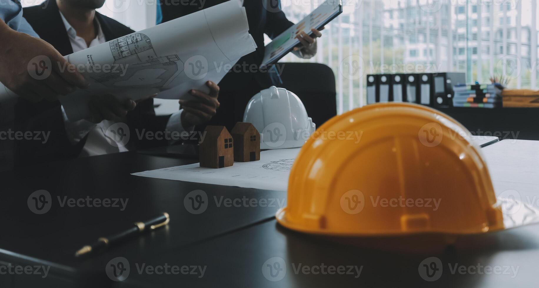 Engineer Teamwork Meeting, Drawing working on blueprint meeting for project working with partner on model building and engineering tools in working site, Construction and structure concept. photo