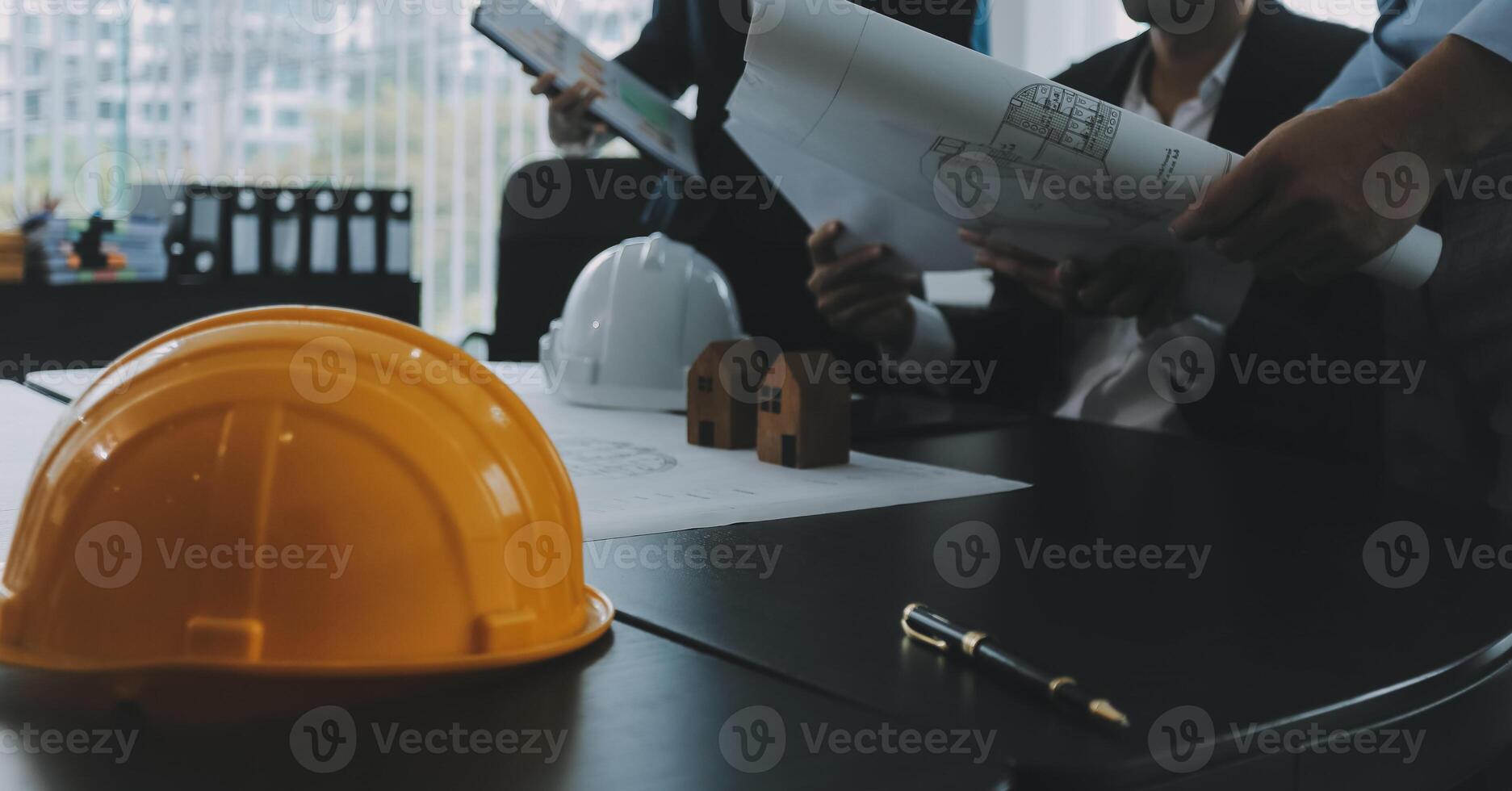 Engineer Teamwork Meeting, Drawing working on blueprint meeting for project working with partner on model building and engineering tools in working site, Construction and structure concept. photo