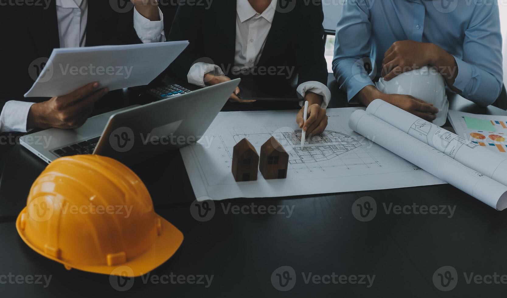 Engineer Teamwork Meeting, Drawing working on blueprint meeting for project working with partner on model building and engineering tools in working site, Construction and structure concept. photo