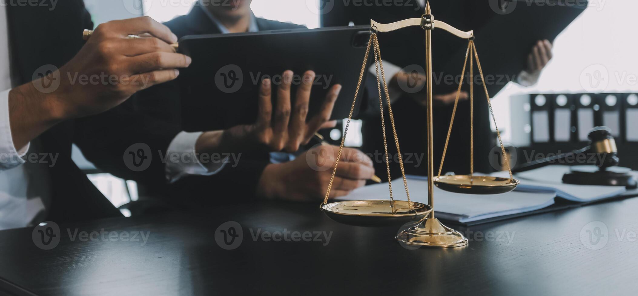 Group of experienced attorneys and lawyers giving consultation to client, helping with difficult lawsuit, explaining legal procedures and discussing agreement terms. Law services and support concept photo