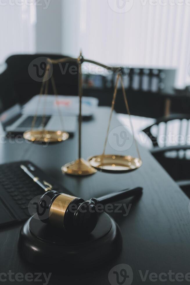 Group of experienced attorneys and lawyers giving consultation to client, helping with difficult lawsuit, explaining legal procedures and discussing agreement terms. Law services and support concept photo