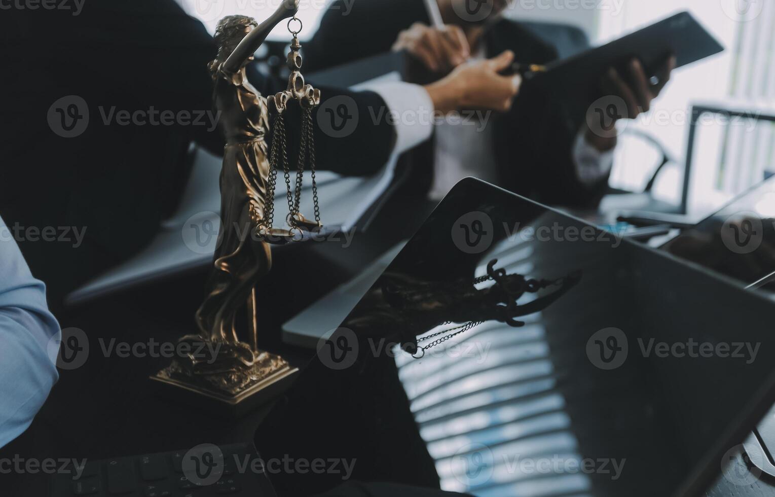 Group of experienced attorneys and lawyers giving consultation to client, helping with difficult lawsuit, explaining legal procedures and discussing agreement terms. Law services and support concept photo