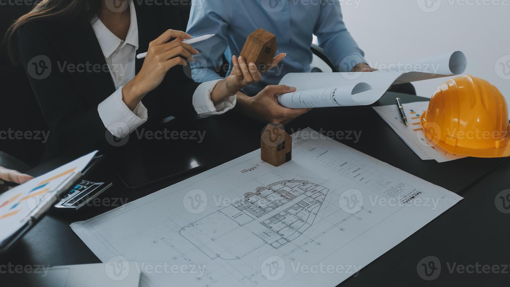 Engineer Teamwork Meeting, Drawing working on blueprint meeting for project working with partner on model building and engineering tools in working site, Construction and structure concept. photo