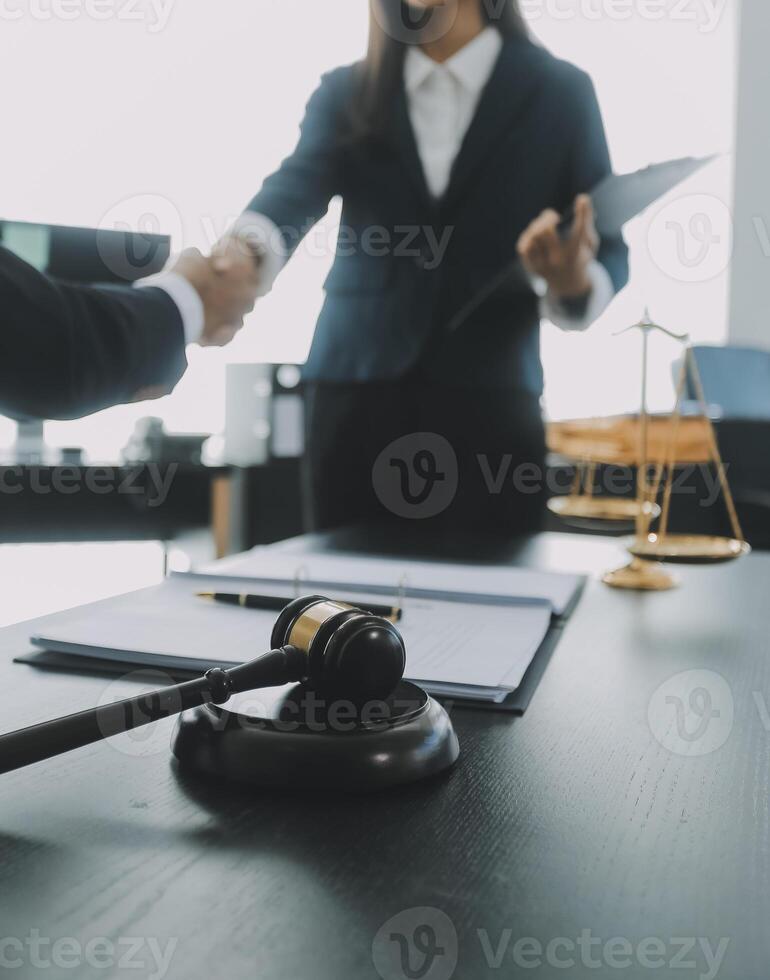 Group of experienced attorneys and lawyers giving consultation to client, helping with difficult lawsuit, explaining legal procedures and discussing agreement terms. Law services and support concept photo