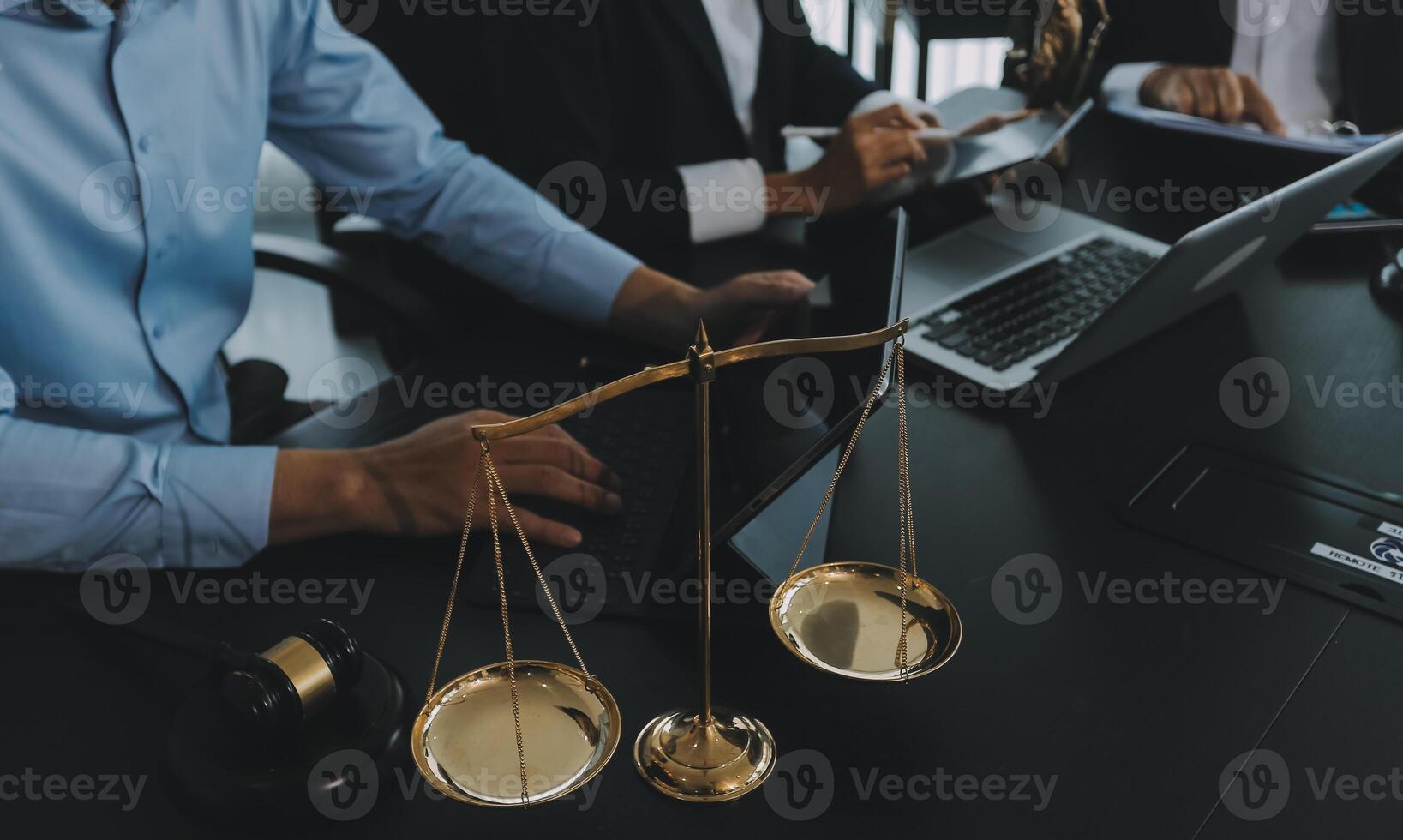 Group of experienced attorneys and lawyers giving consultation to client, helping with difficult lawsuit, explaining legal procedures and discussing agreement terms. Law services and support concept photo