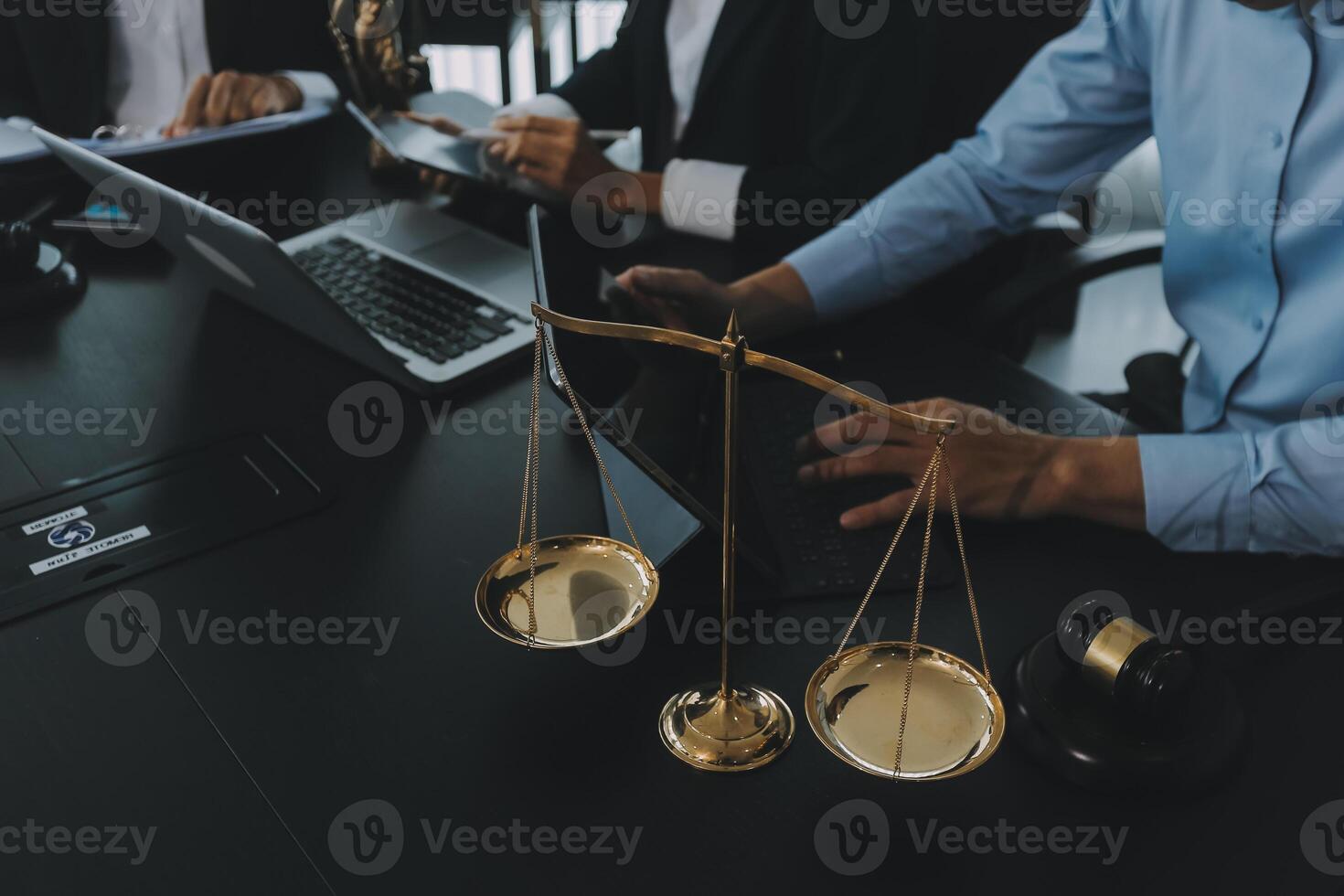 Group of experienced attorneys and lawyers giving consultation to client, helping with difficult lawsuit, explaining legal procedures and discussing agreement terms. Law services and support concept photo