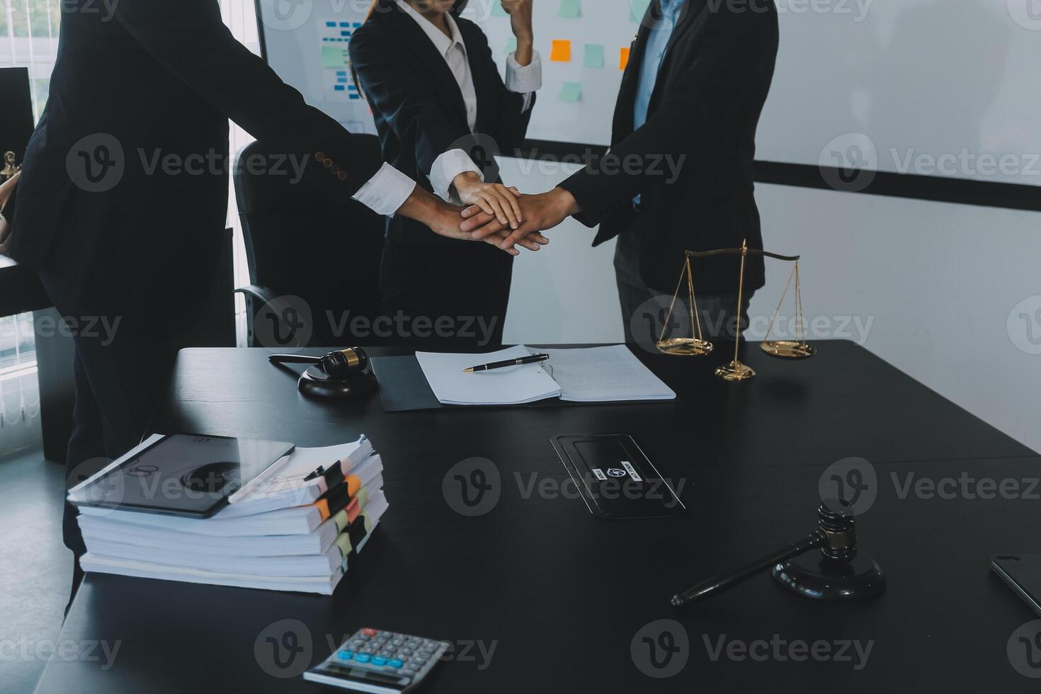 Group of experienced attorneys and lawyers giving consultation to client, helping with difficult lawsuit, explaining legal procedures and discussing agreement terms. Law services and support concept photo