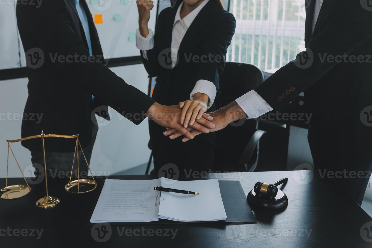 Group of experienced attorneys and lawyers giving consultation to client, helping with difficult lawsuit, explaining legal procedures and discussing agreement terms. Law services and support concept photo