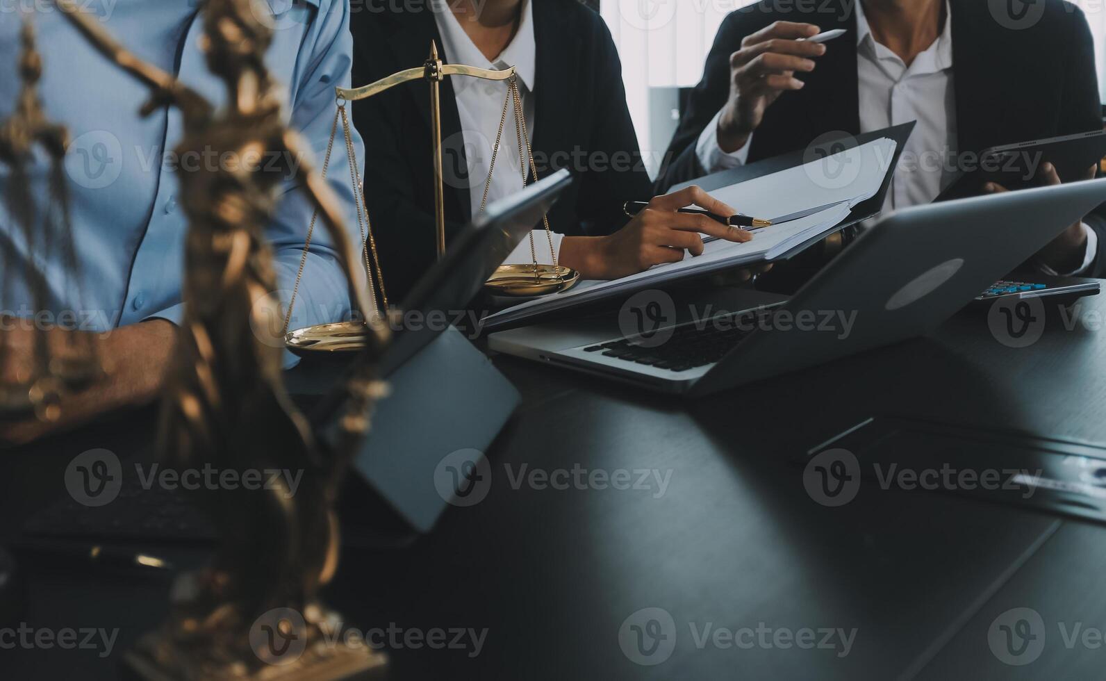 Group of experienced attorneys and lawyers giving consultation to client, helping with difficult lawsuit, explaining legal procedures and discussing agreement terms. Law services and support concept photo