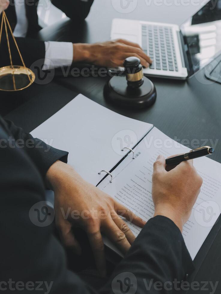 Group of experienced attorneys and lawyers giving consultation to client, helping with difficult lawsuit, explaining legal procedures and discussing agreement terms. Law services and support concept photo