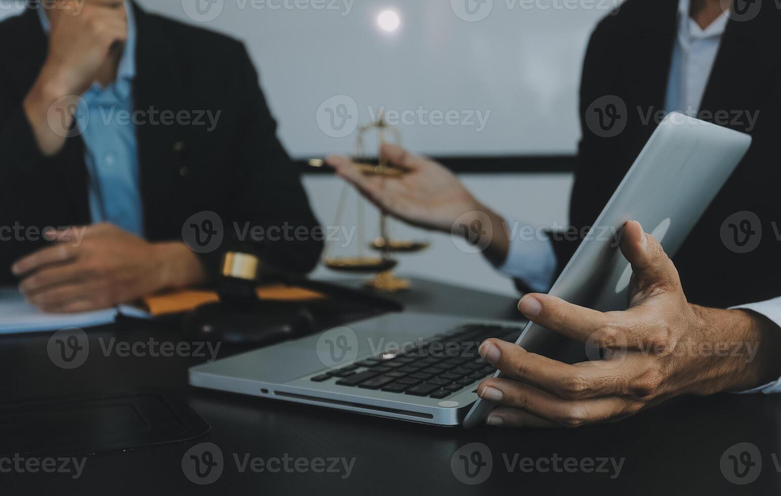 Group of experienced attorneys and lawyers giving consultation to client, helping with difficult lawsuit, explaining legal procedures and discussing agreement terms. Law services and support concept photo