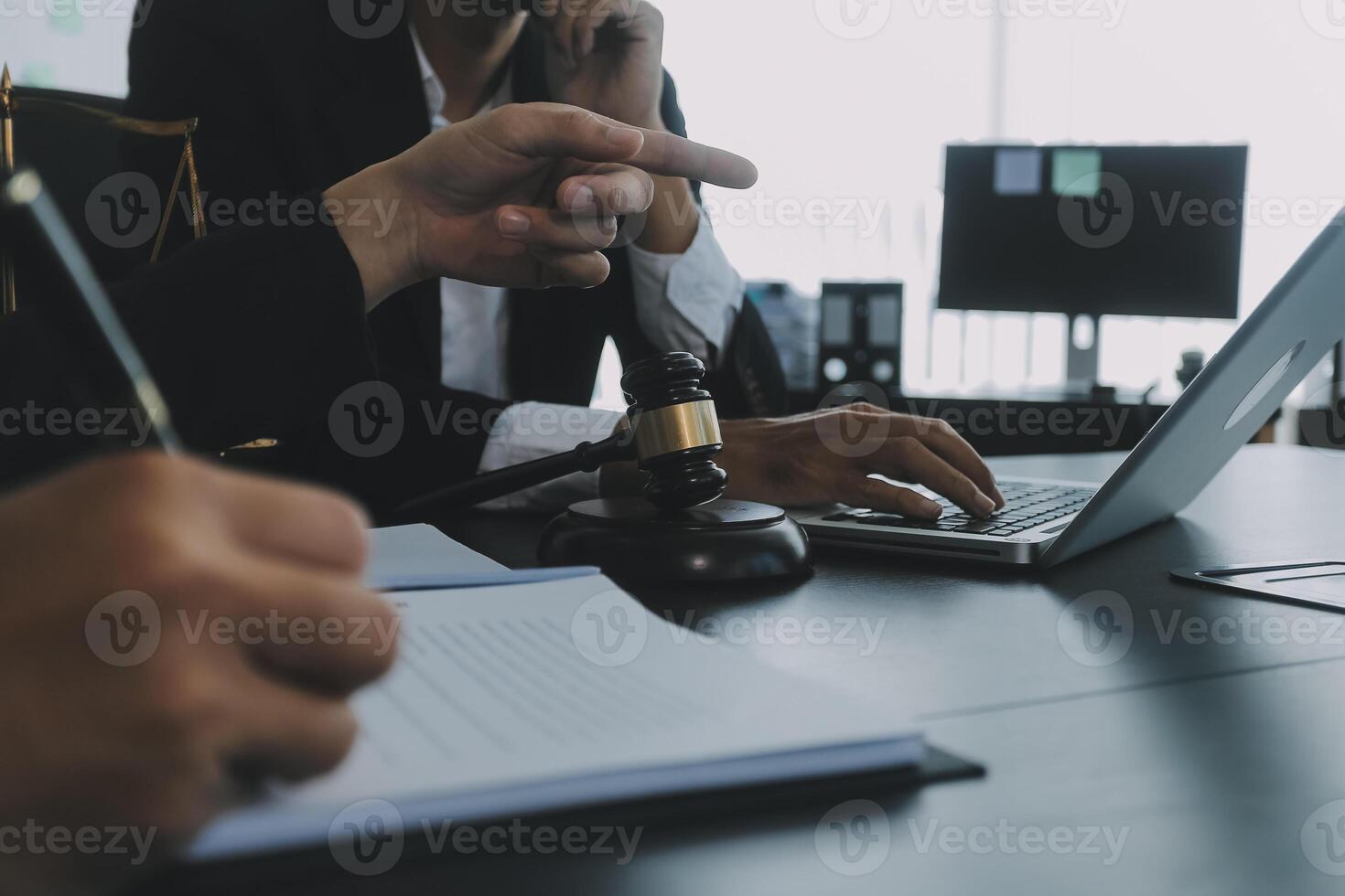 Group of experienced attorneys and lawyers giving consultation to client, helping with difficult lawsuit, explaining legal procedures and discussing agreement terms. Law services and support concept photo