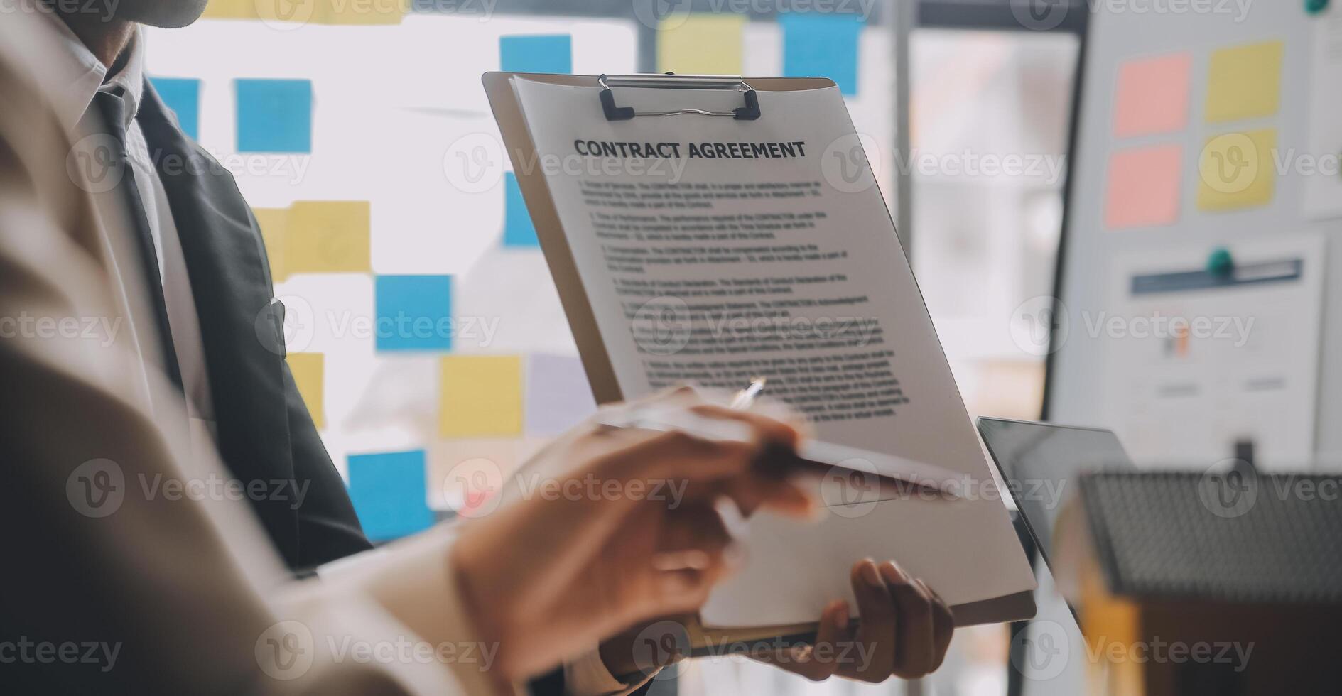 Real estate agent and Sales manager team analysis pricing of rental lease contract of sale purchase agreement, concerning mortgage loan offer for and house insurance. photo