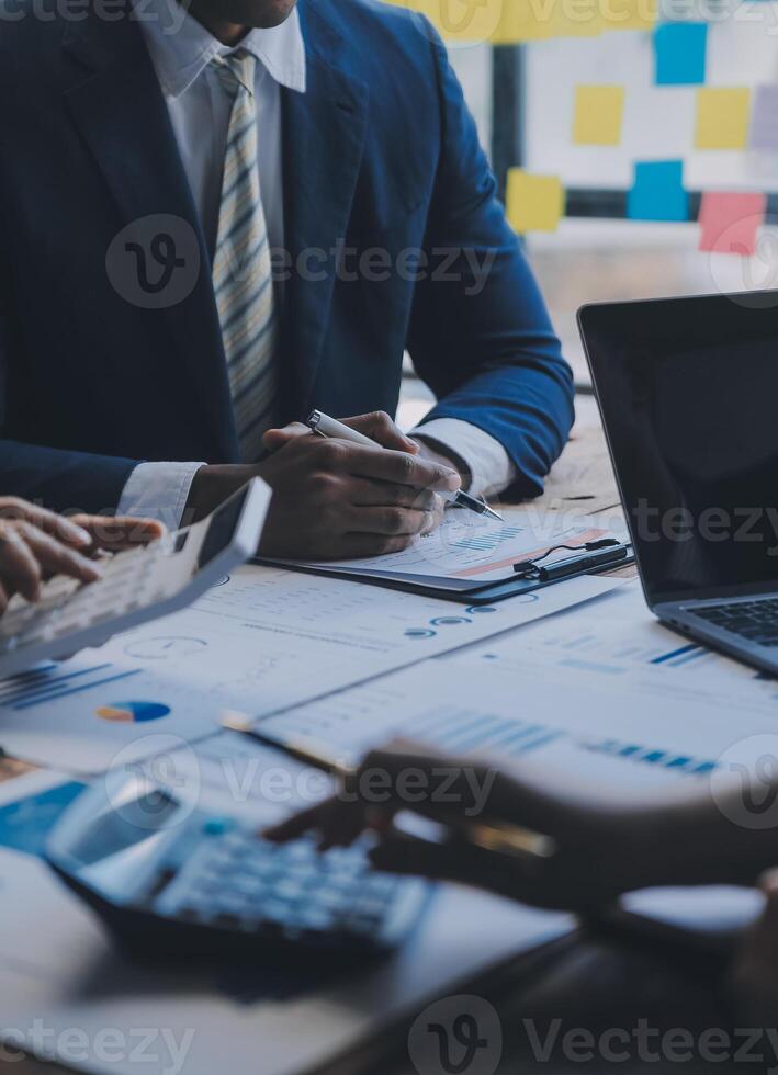 Co working conference, Business team meeting present, investor colleagues discussing new plan financial graph data on office table with laptop and digital tablet, Finance, accounting, investment. photo