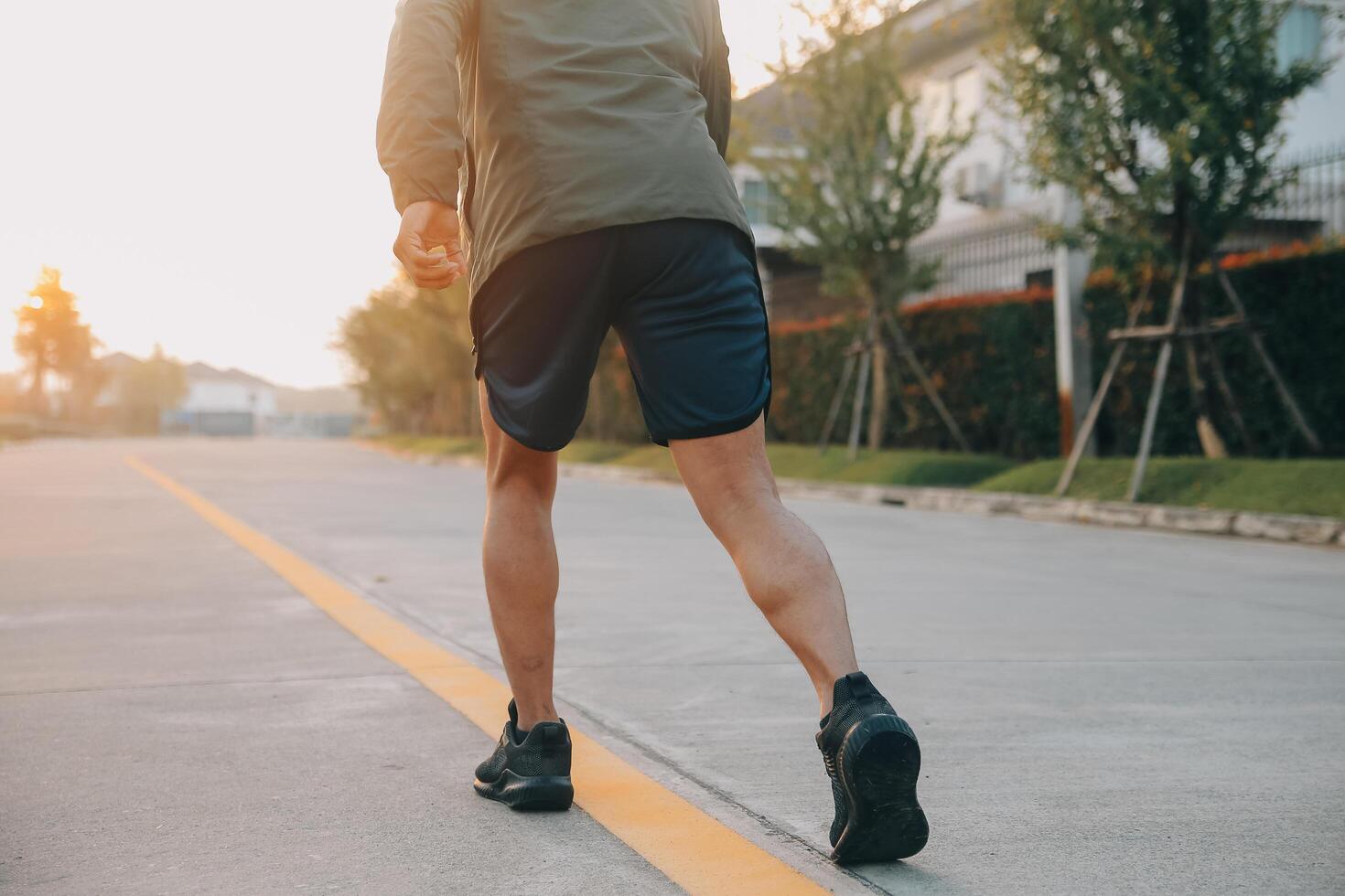Athlete runner feet running on road,Jogging concept at outdoors. Man running for exercise.Athlete runner feet running on road, Jogging concept at outdoors. Man running for exercise. photo