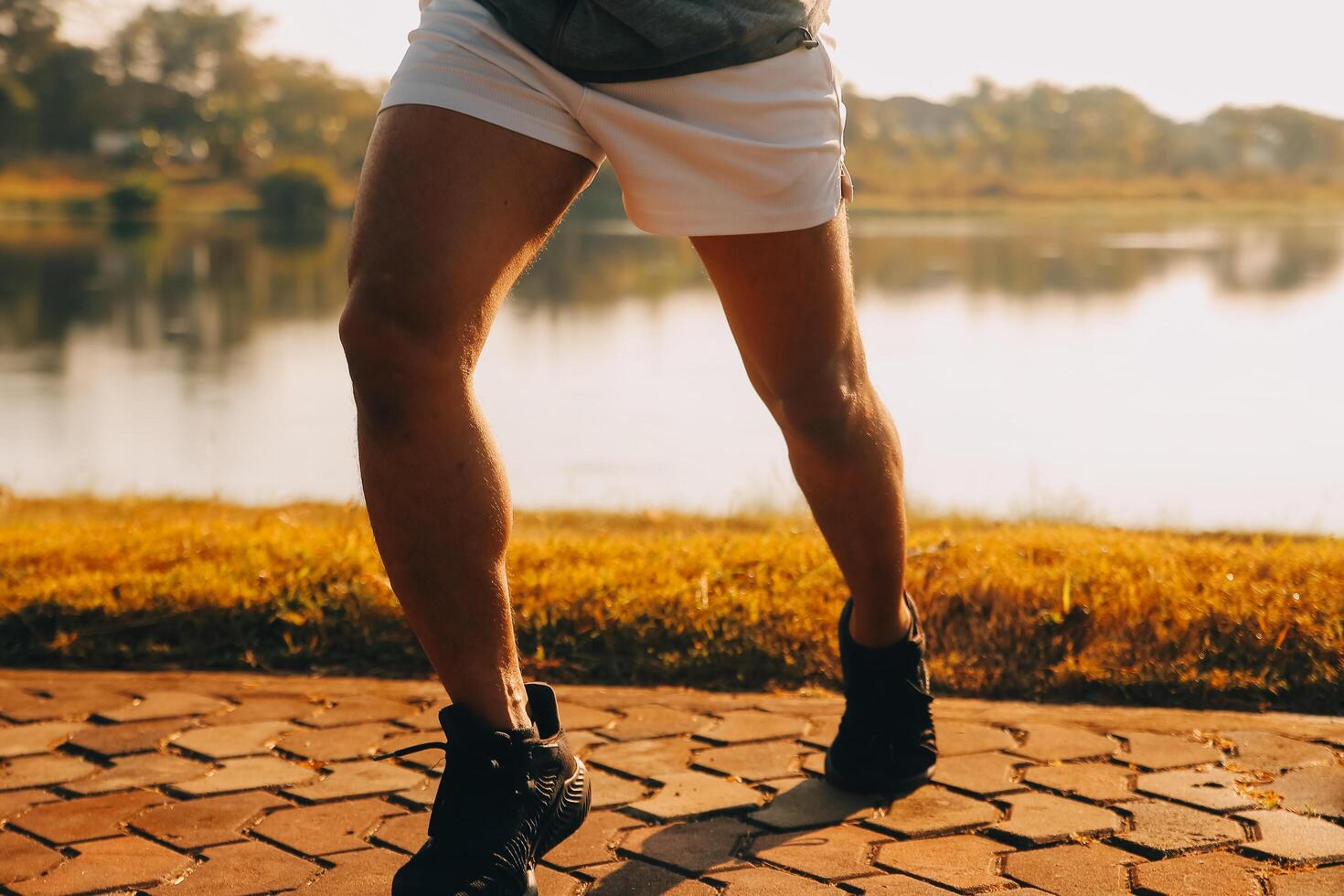 Athlete runner feet running on road,Jogging concept at outdoors. Man running for exercise.Athlete runner feet running on road, Jogging concept at outdoors. Man running for exercise. photo