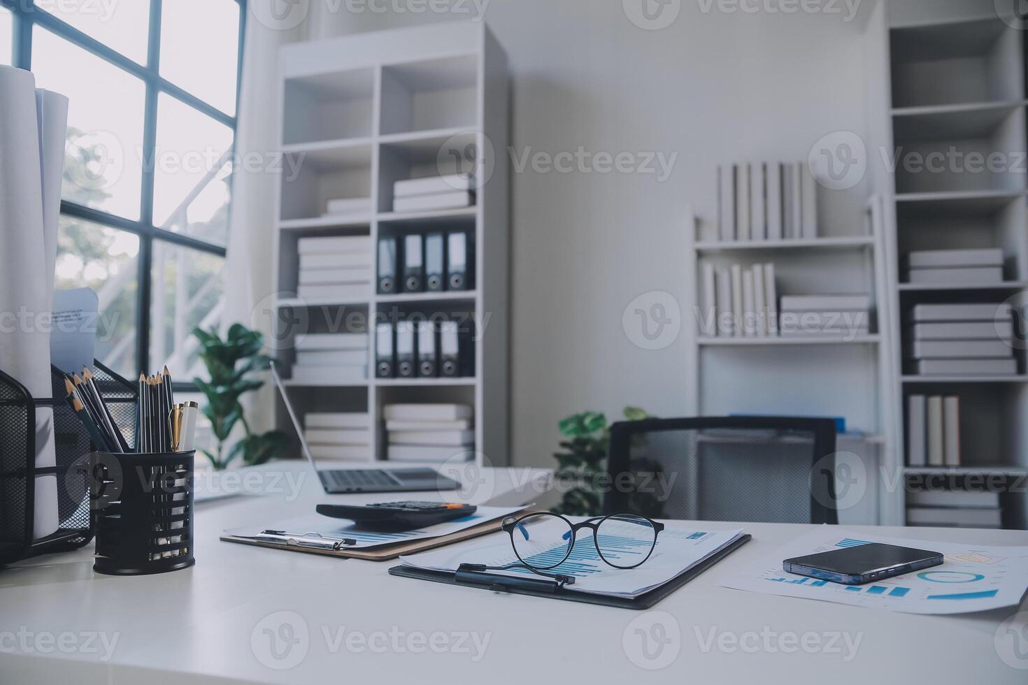 Financial analysts analyze business financial reports on a digital tablet planning investment project during a discussion at a meeting of corporate showing the results of their successful teamwork. photo