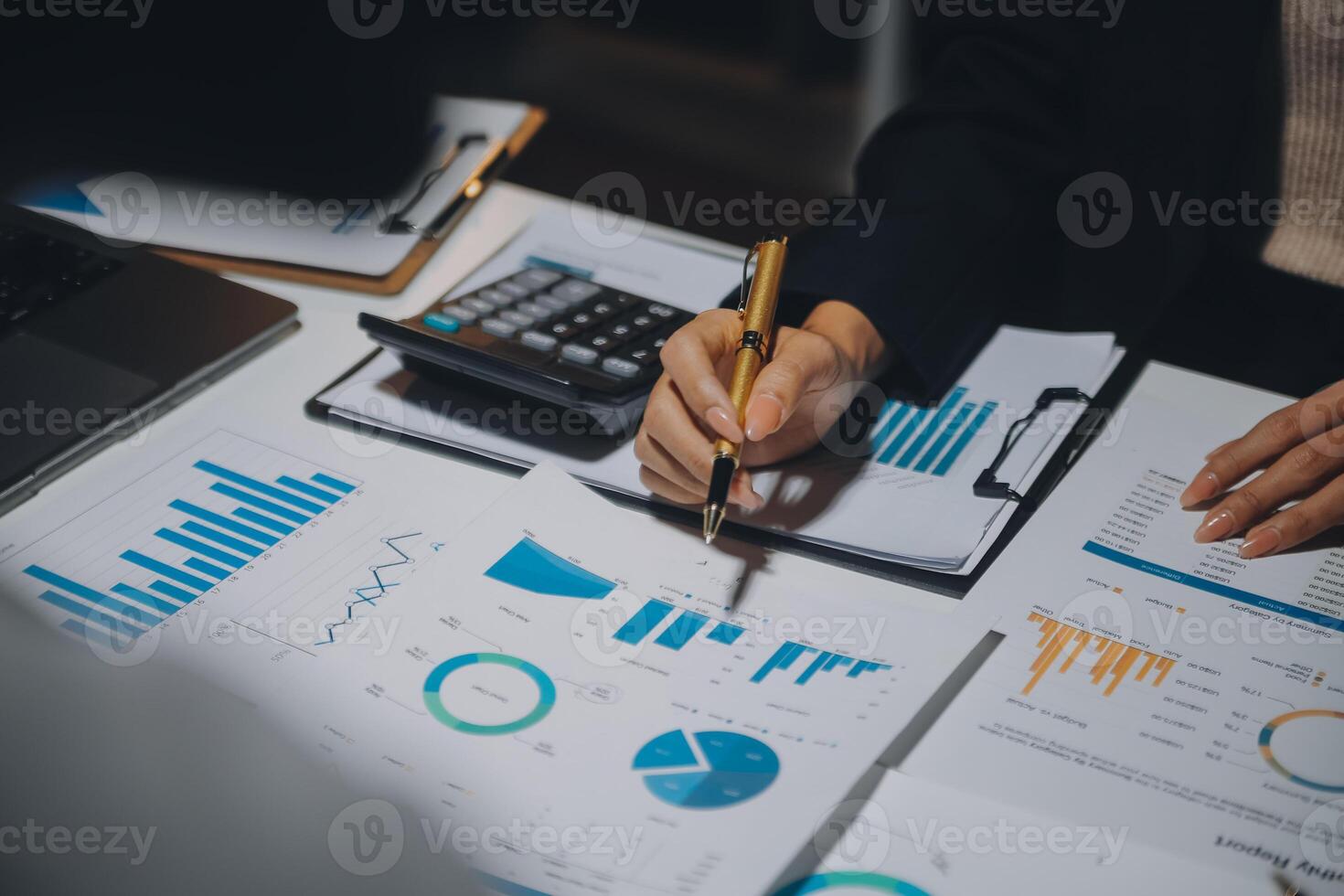Financial analysts analyze business financial reports on a digital tablet planning investment project during a discussion at a meeting of corporate showing the results of their successful teamwork. photo