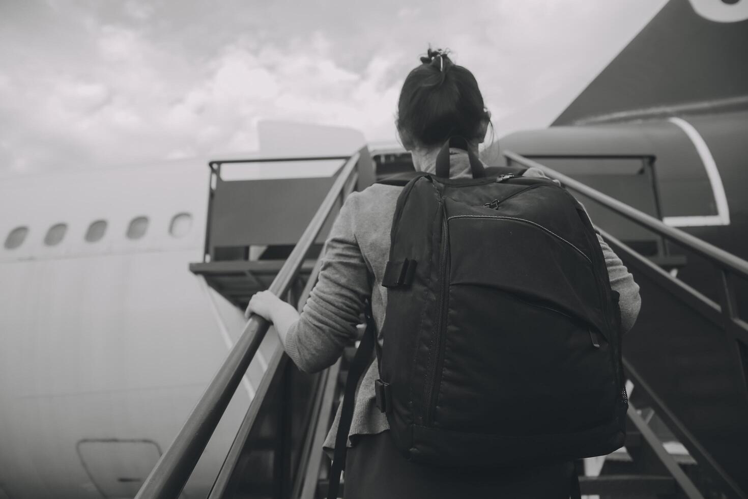 Happy attractive asian woman traveler with backpack at the modern airport terminal, copy space, Tourist journey trip concept photo