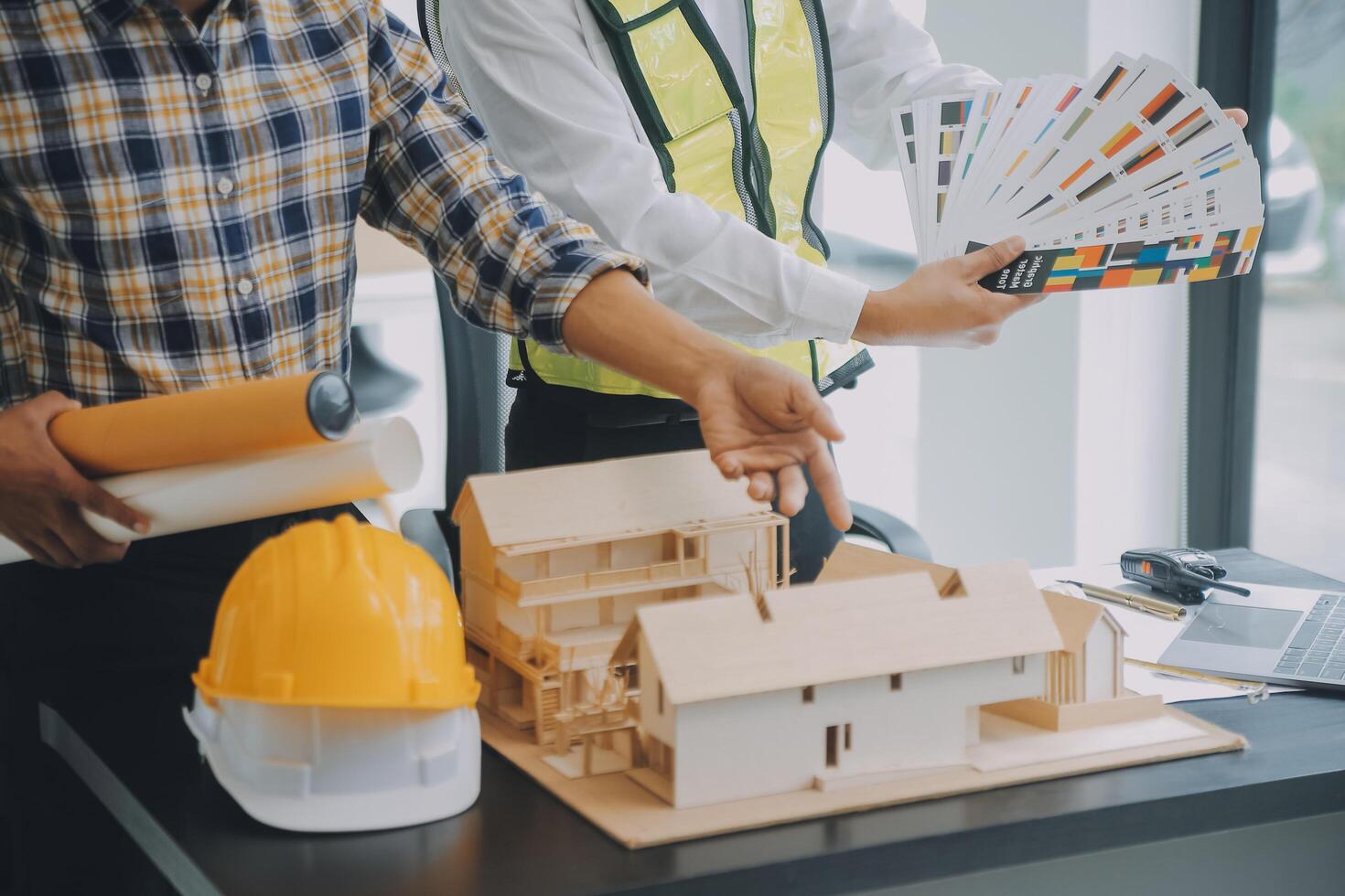 Construction and structure concept of Engineer or architect meeting for project working with partner and engineering tools on model building and blueprint in working site, contract for both companies. photo