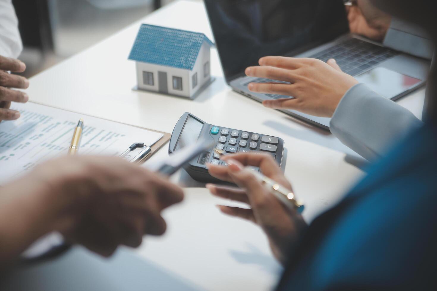 Real estate agent and customer signing contract to buy house, insurance or loan real estate.rent a house,get insurance or loan real estate or property. photo