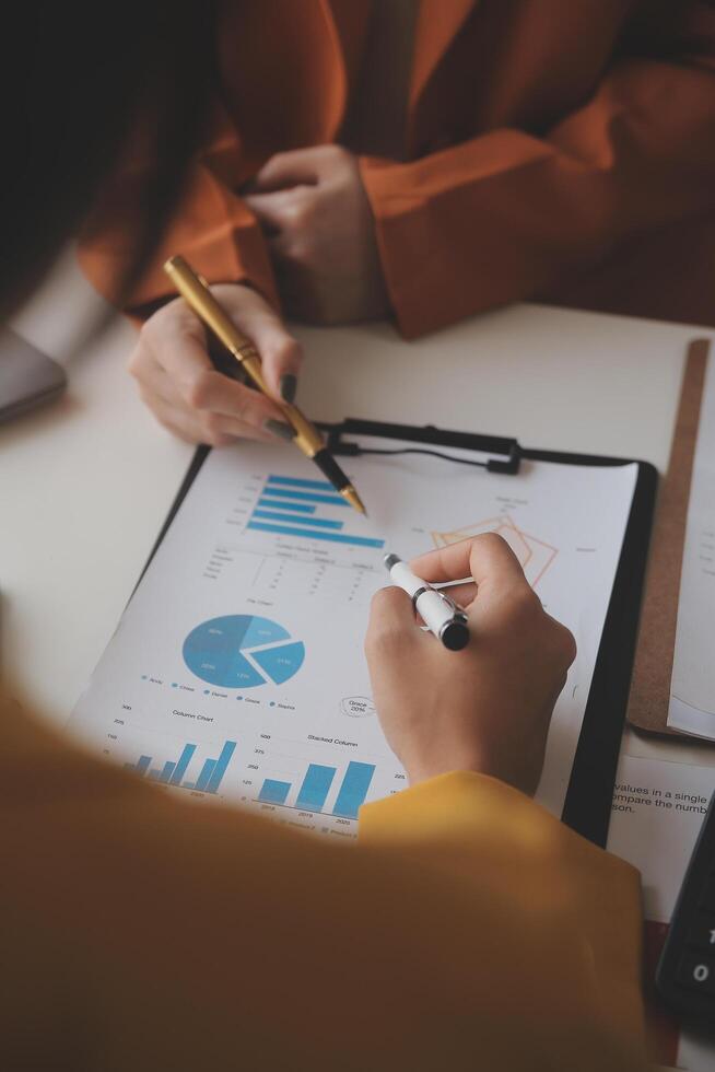 Team of business people working together in the meeting room office, teamwork background charts and graphs banner, double exposure successful teamwork,business planning concept. photo
