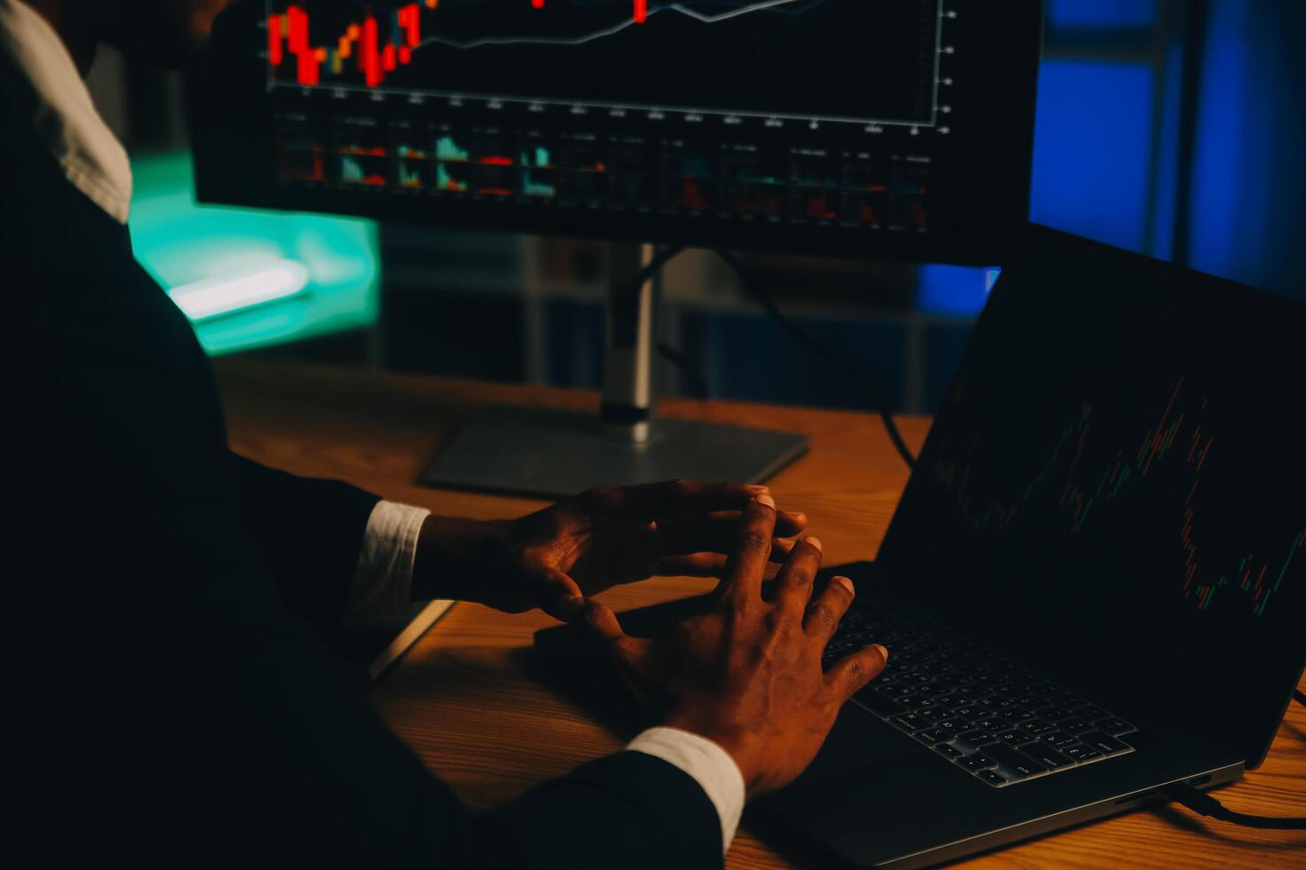 Thoughtful focused successful caucasian male stock investor, broker, financial adviser, sits at work desk, looks at computer, pensively analyze risks and prospects, rise or fall of cryptocurrency coin photo