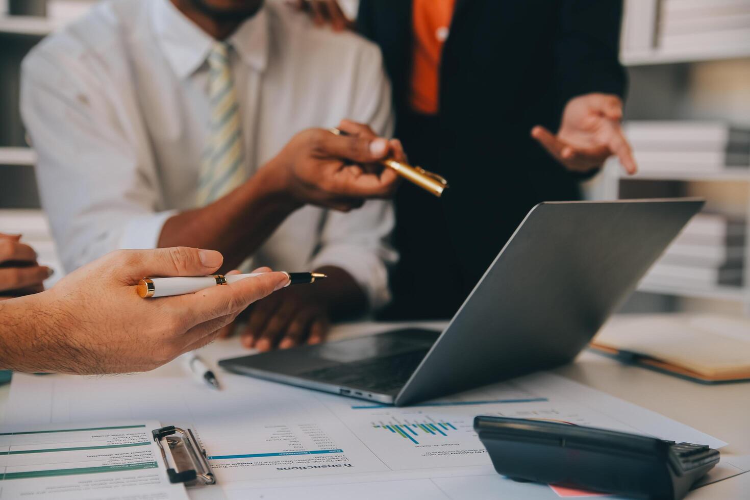 Co working conference, Business team meeting present, investor colleagues discussing new plan financial graph data on office table with laptop and digital tablet, Finance, accounting, investment. photo
