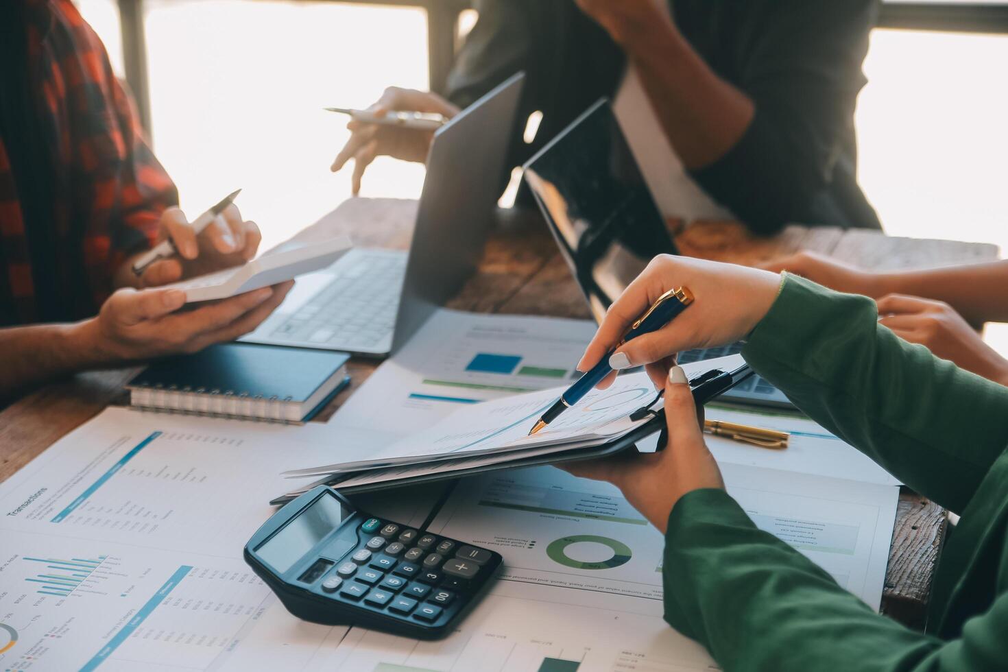 Co working conference, Business team meeting present, investor colleagues discussing new plan financial graph data on office table with laptop and digital tablet, Finance, accounting, investment. photo