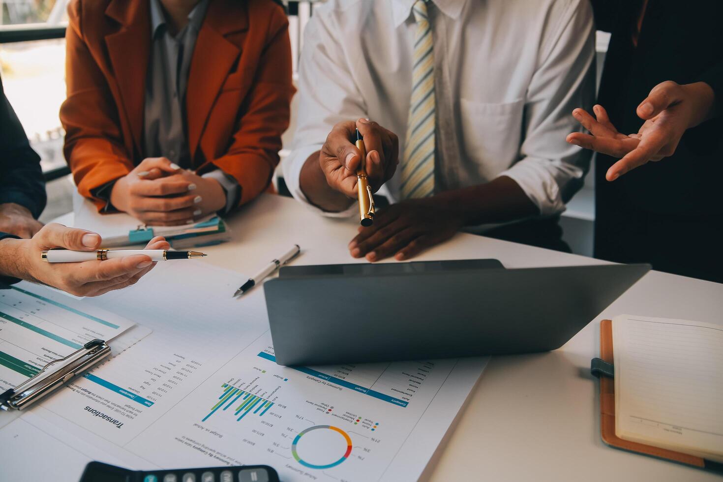Co working conference, Business team meeting present, investor colleagues discussing new plan financial graph data on office table with laptop and digital tablet, Finance, accounting, investment. photo