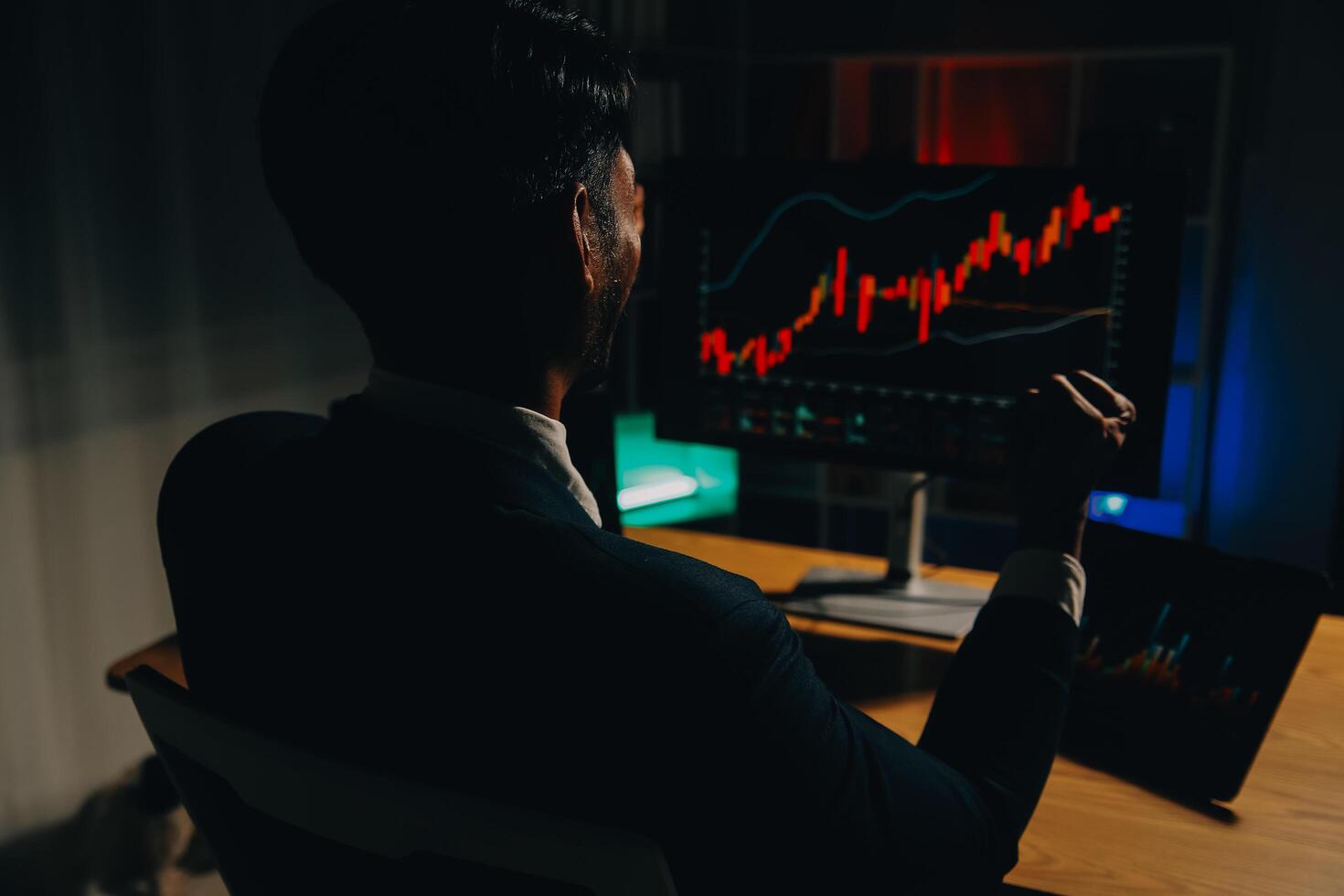 Thoughtful focused successful caucasian male stock investor, broker, financial adviser, sits at work desk, looks at computer, pensively analyze risks and prospects, rise or fall of cryptocurrency coin photo
