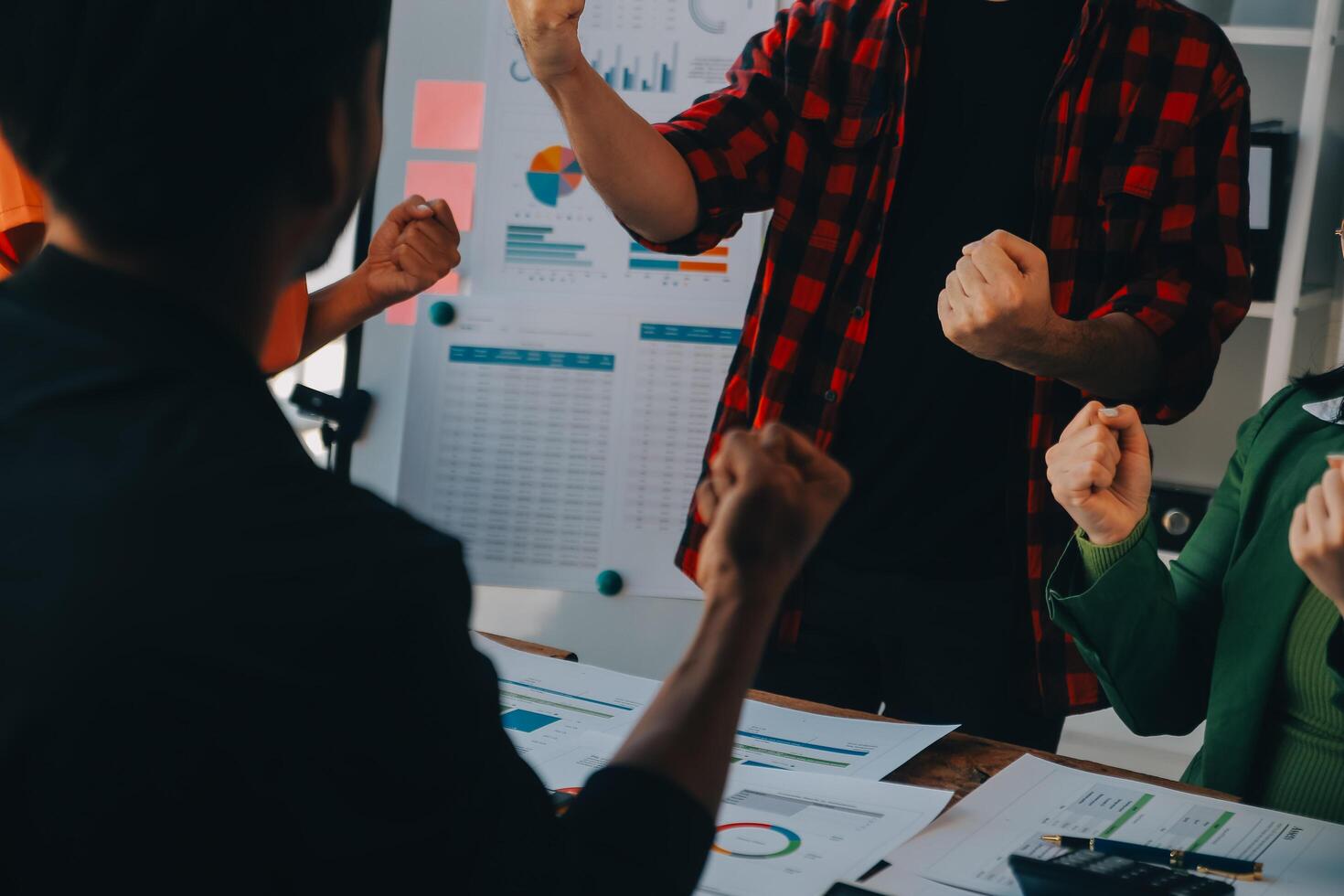 Cheerful business colleagues applauding in meeting at coworking office photo