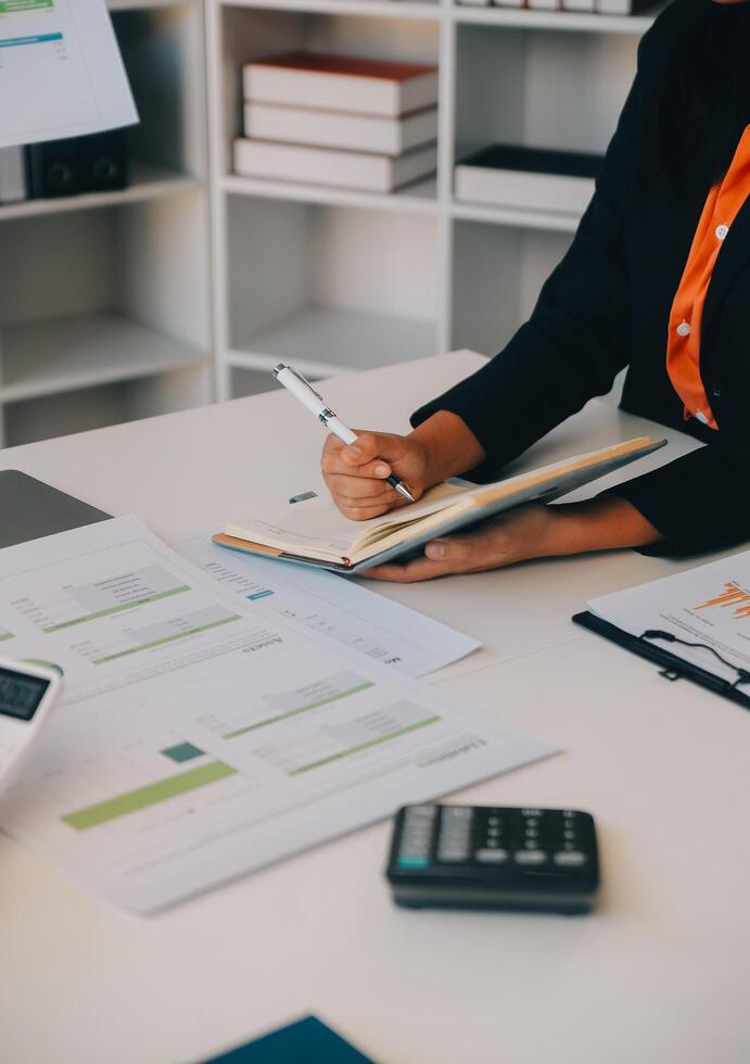 Co working conference, Business team meeting present, investor colleagues discussing new plan financial graph data on office table with laptop and digital tablet, Finance, accounting, investment. photo