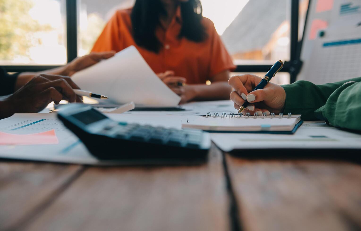 Co working conference, Business team meeting present, investor colleagues discussing new plan financial graph data on office table with laptop and digital tablet, Finance, accounting, investment. photo