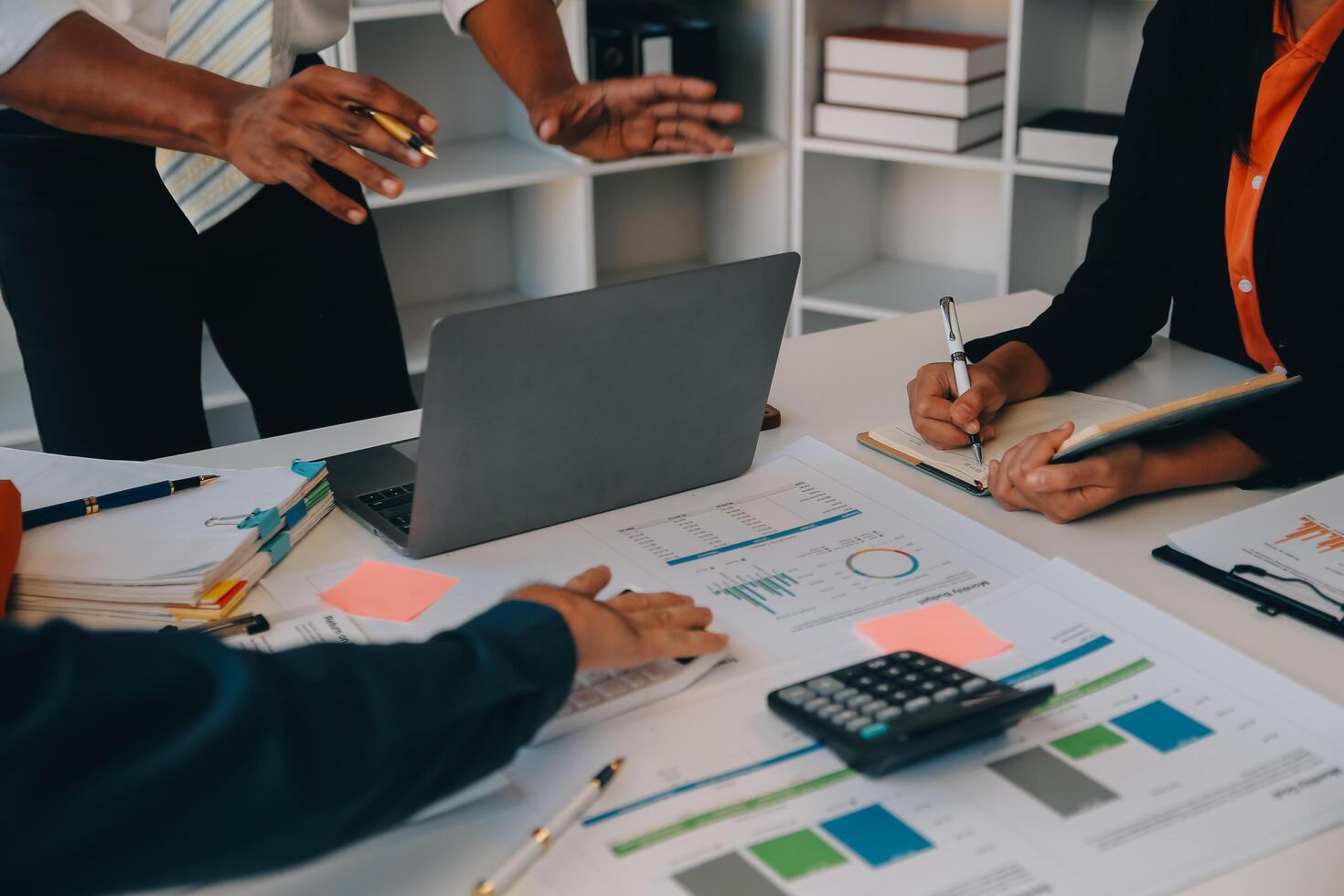 Co working conference, Business team meeting present, investor colleagues discussing new plan financial graph data on office table with laptop and digital tablet, Finance, accounting, investment. photo