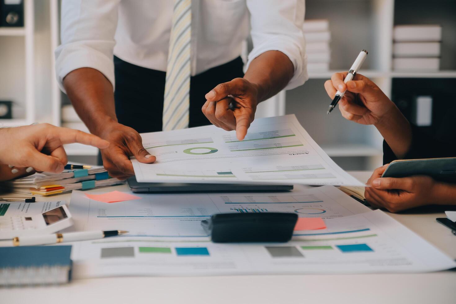 Co working conference, Business team meeting present, investor colleagues discussing new plan financial graph data on office table with laptop and digital tablet, Finance, accounting, investment. photo