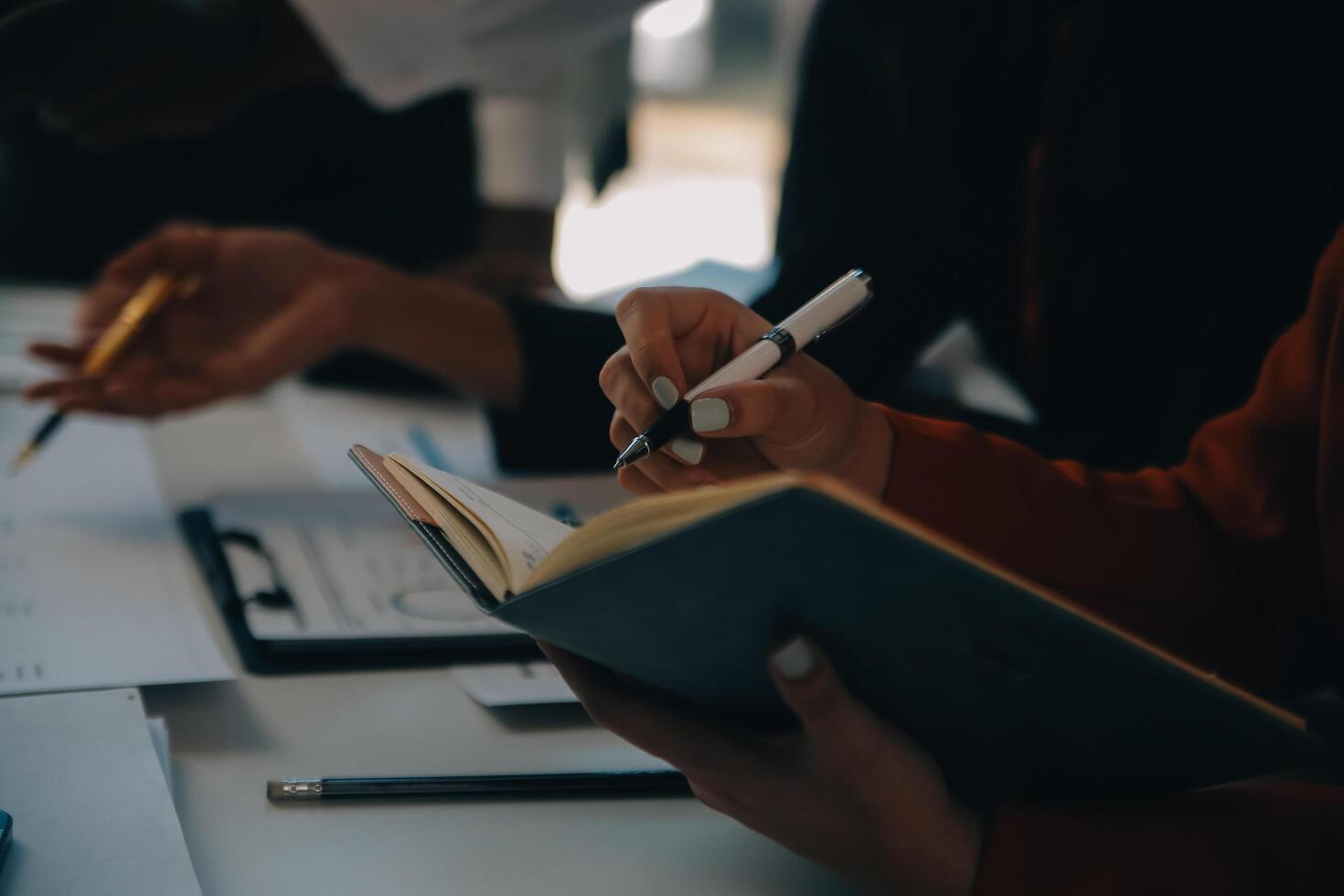 Business team working with new startup project plan and discussion information for financial strategy with laptop and digital tablet in a modern business lounge. photo