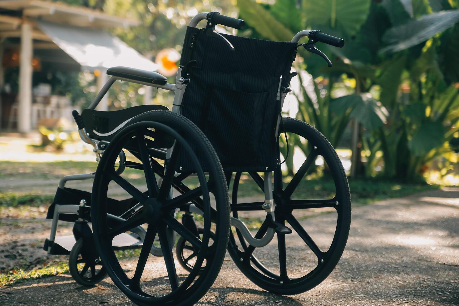 Single wheelchair parked in hospital hallway photo