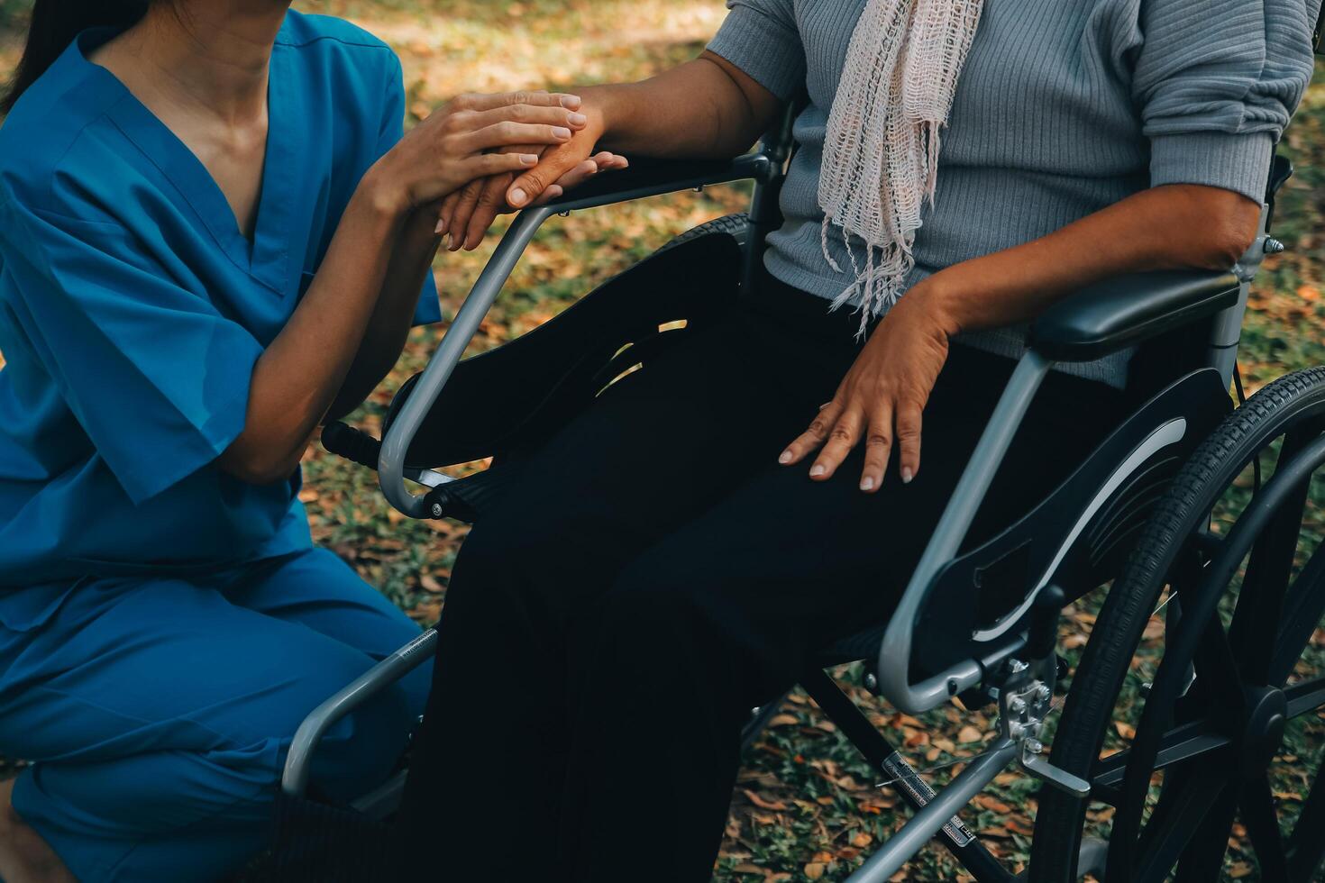 Young asian caretaker with 60s asia elderly woman consulting and encourage, take a history and recommend the right treatment to live happily in retirement, holding hands and encouraging photo