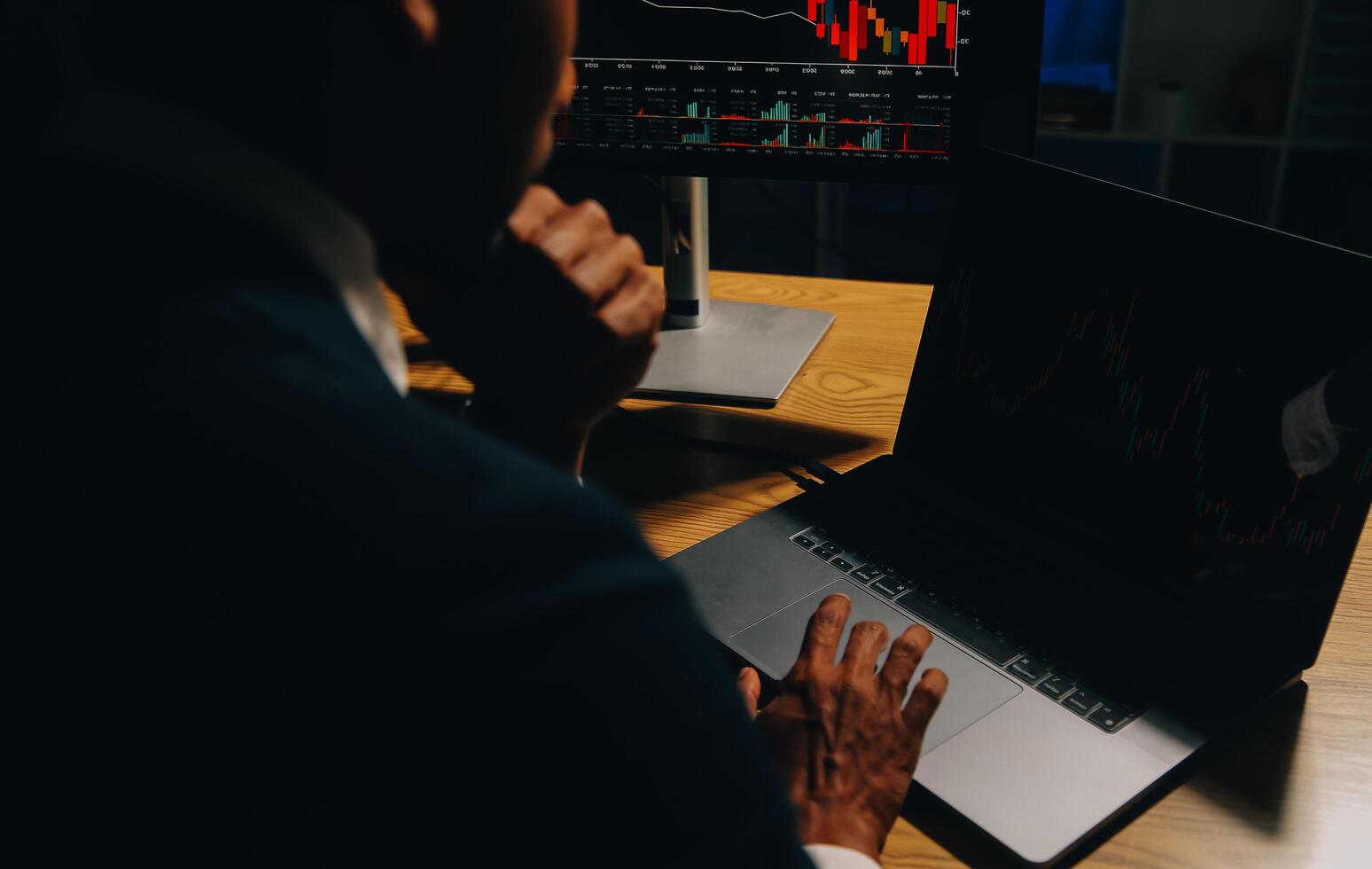 Thoughtful focused successful caucasian male stock investor, broker, financial adviser, sits at work desk, looks at computer, pensively analyze risks and prospects, rise or fall of cryptocurrency coin photo