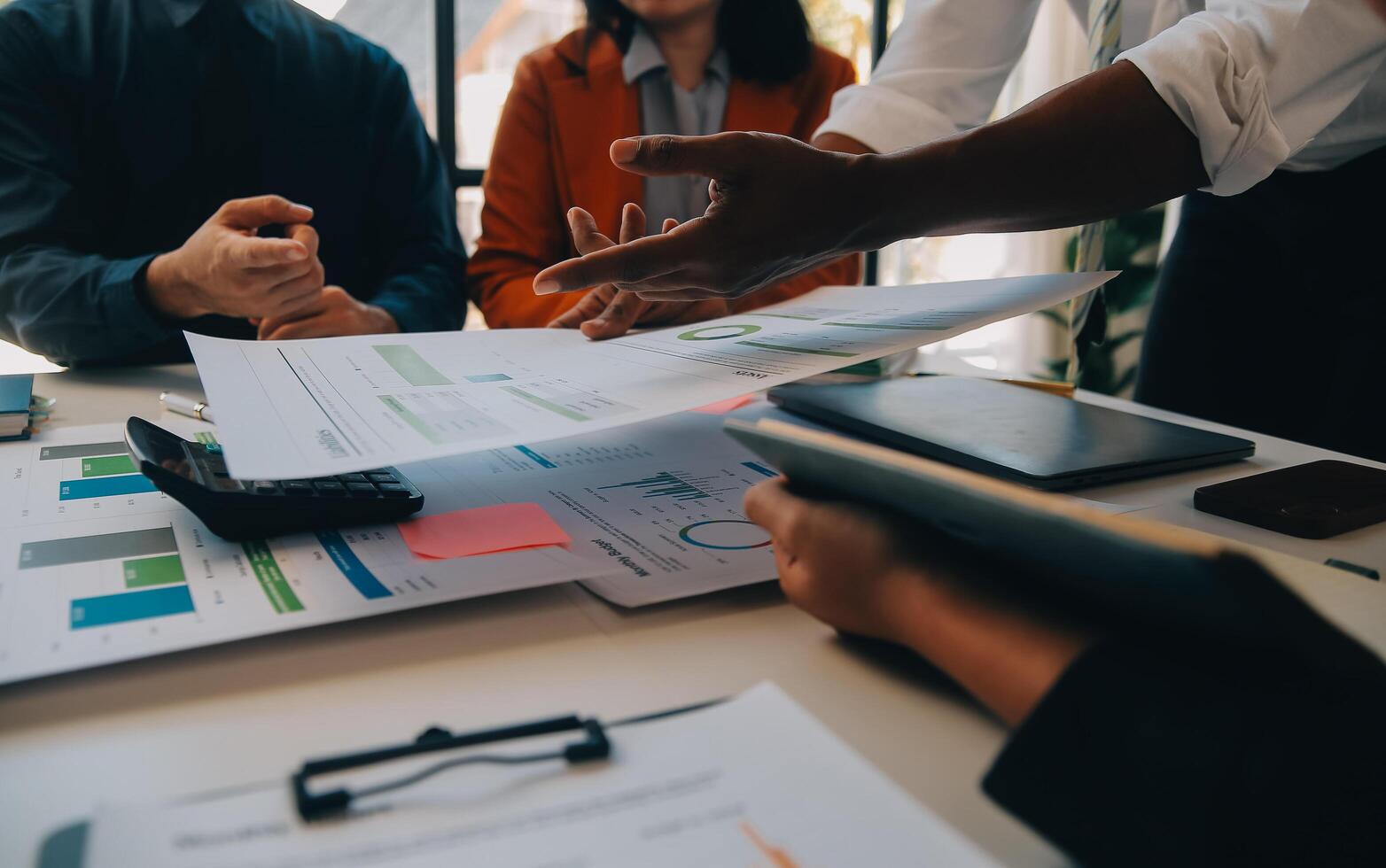 Co working conference, Business team meeting present, investor colleagues discussing new plan financial graph data on office table with laptop and digital tablet, Finance, accounting, investment. photo