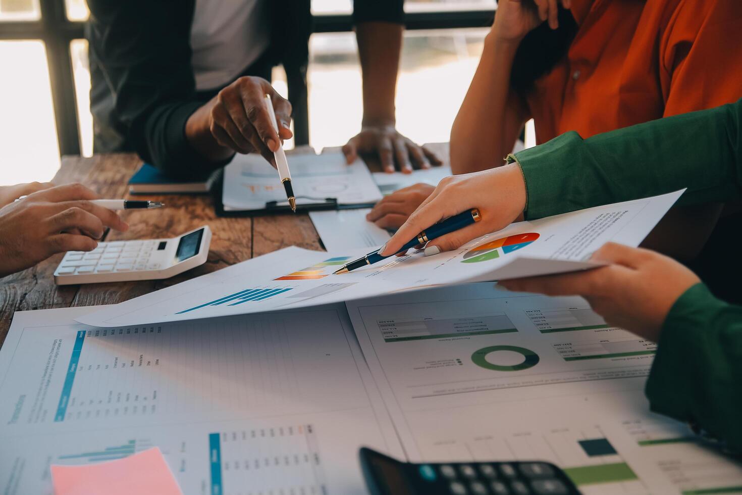 Co working conference, Business team meeting present, investor colleagues discussing new plan financial graph data on office table with laptop and digital tablet, Finance, accounting, investment. photo