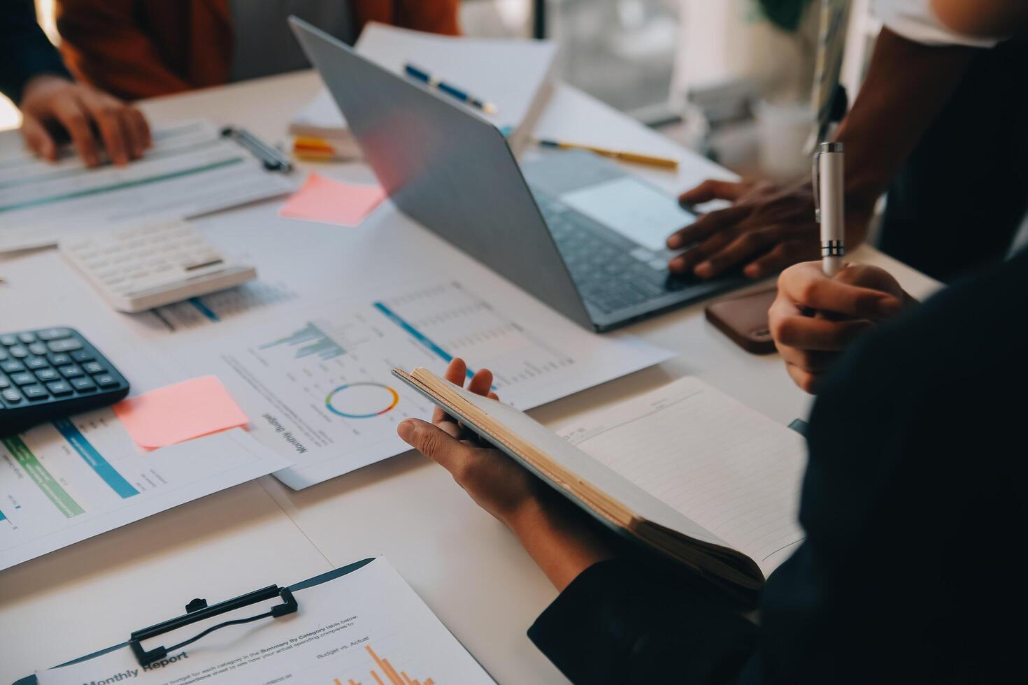 Co working conference, Business team meeting present, investor colleagues discussing new plan financial graph data on office table with laptop and digital tablet, Finance, accounting, investment. photo