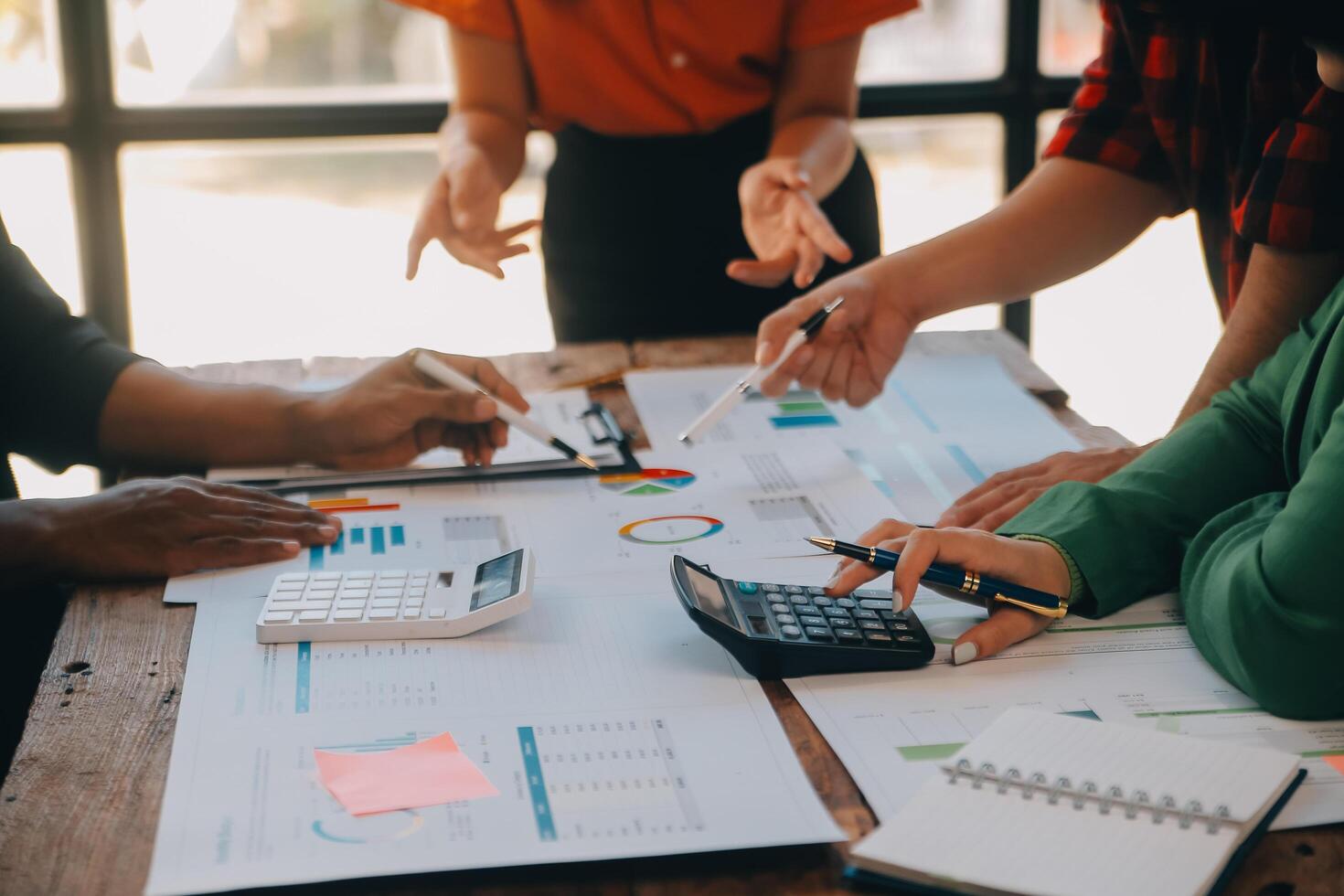 Co working conference, Business team meeting present, investor colleagues discussing new plan financial graph data on office table with laptop and digital tablet, Finance, accounting, investment. photo